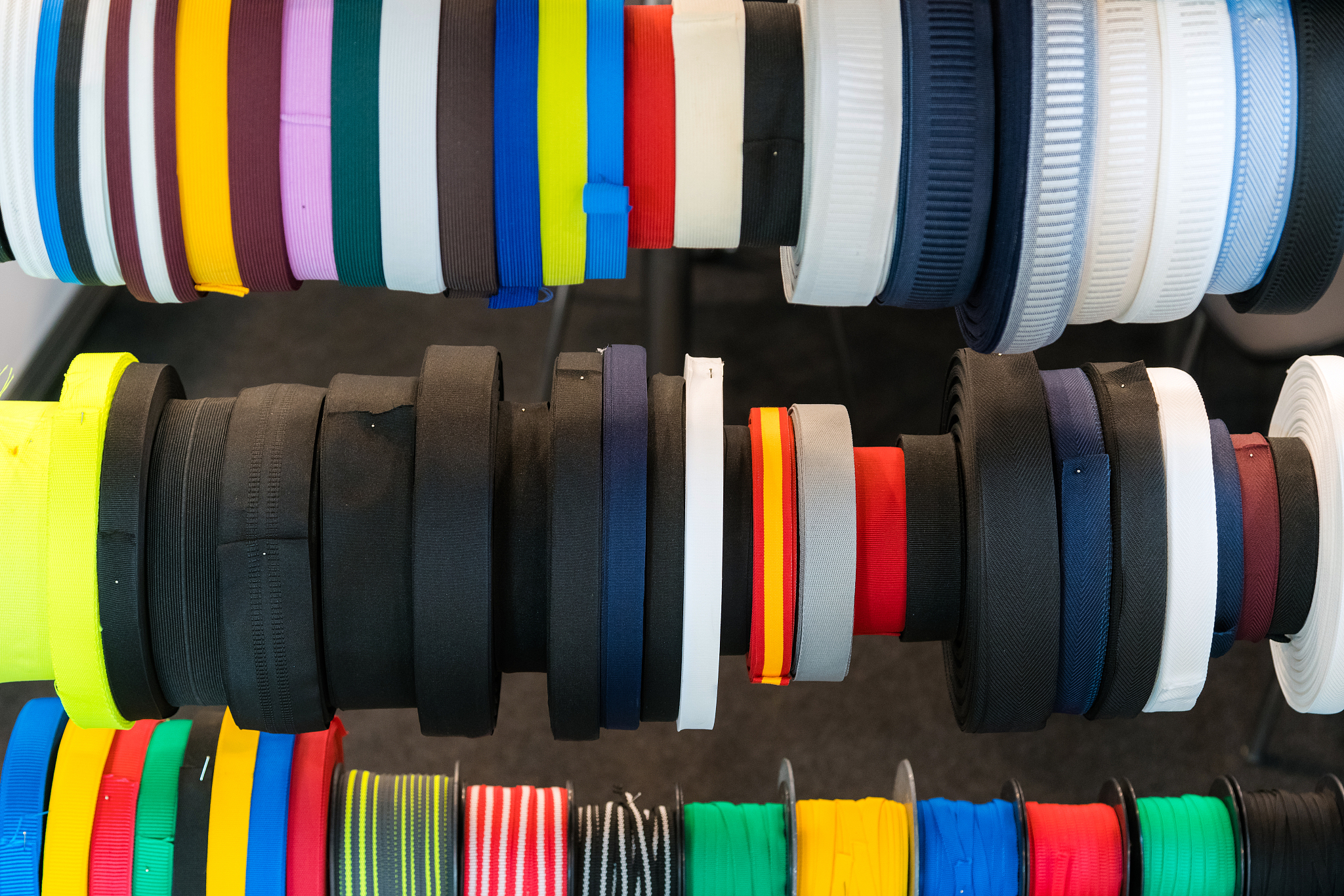 colourful embroidery thread spool using in garment industry, row