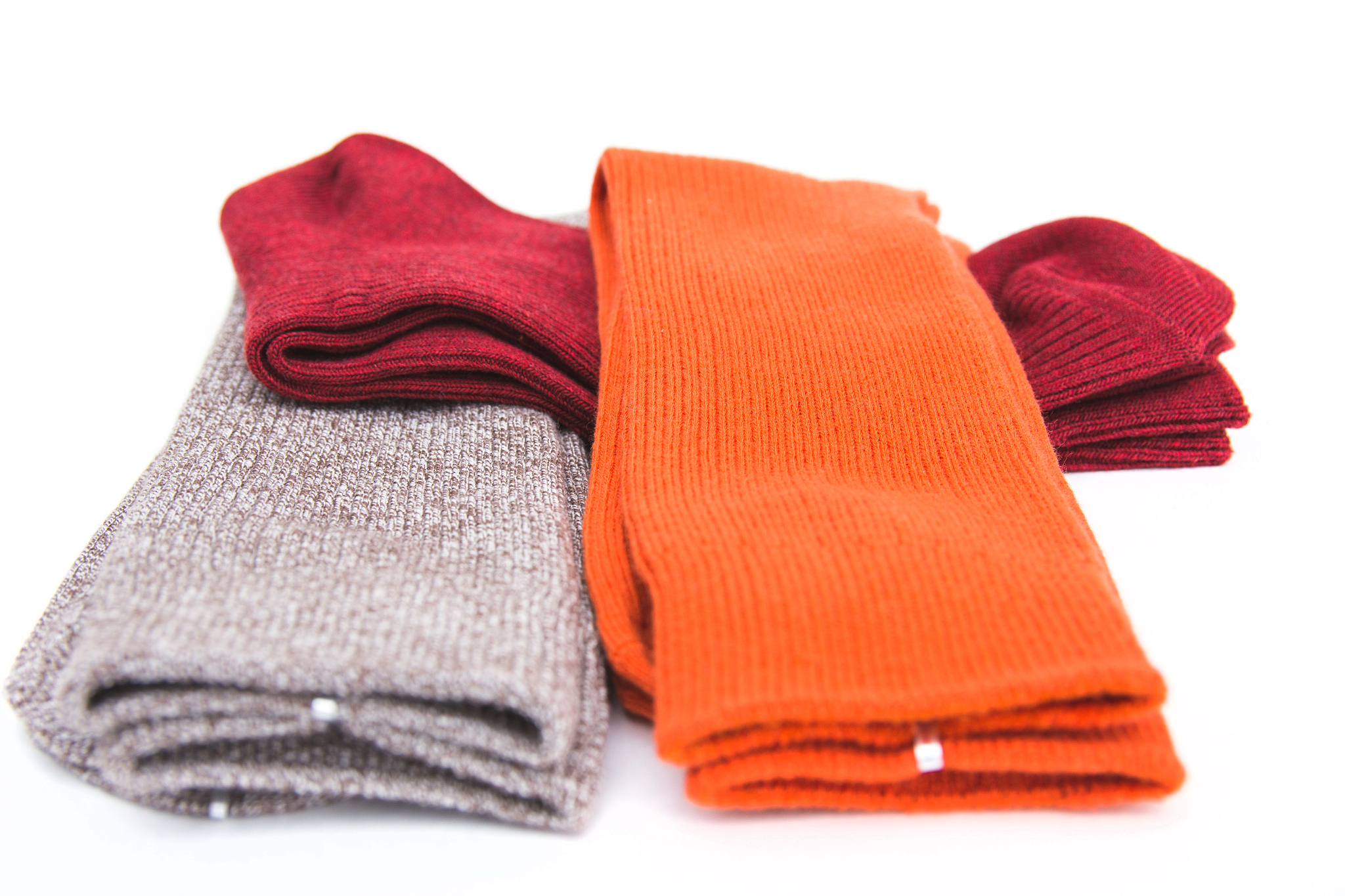 a set of stylish colorful multicolored man socks, lying one on a