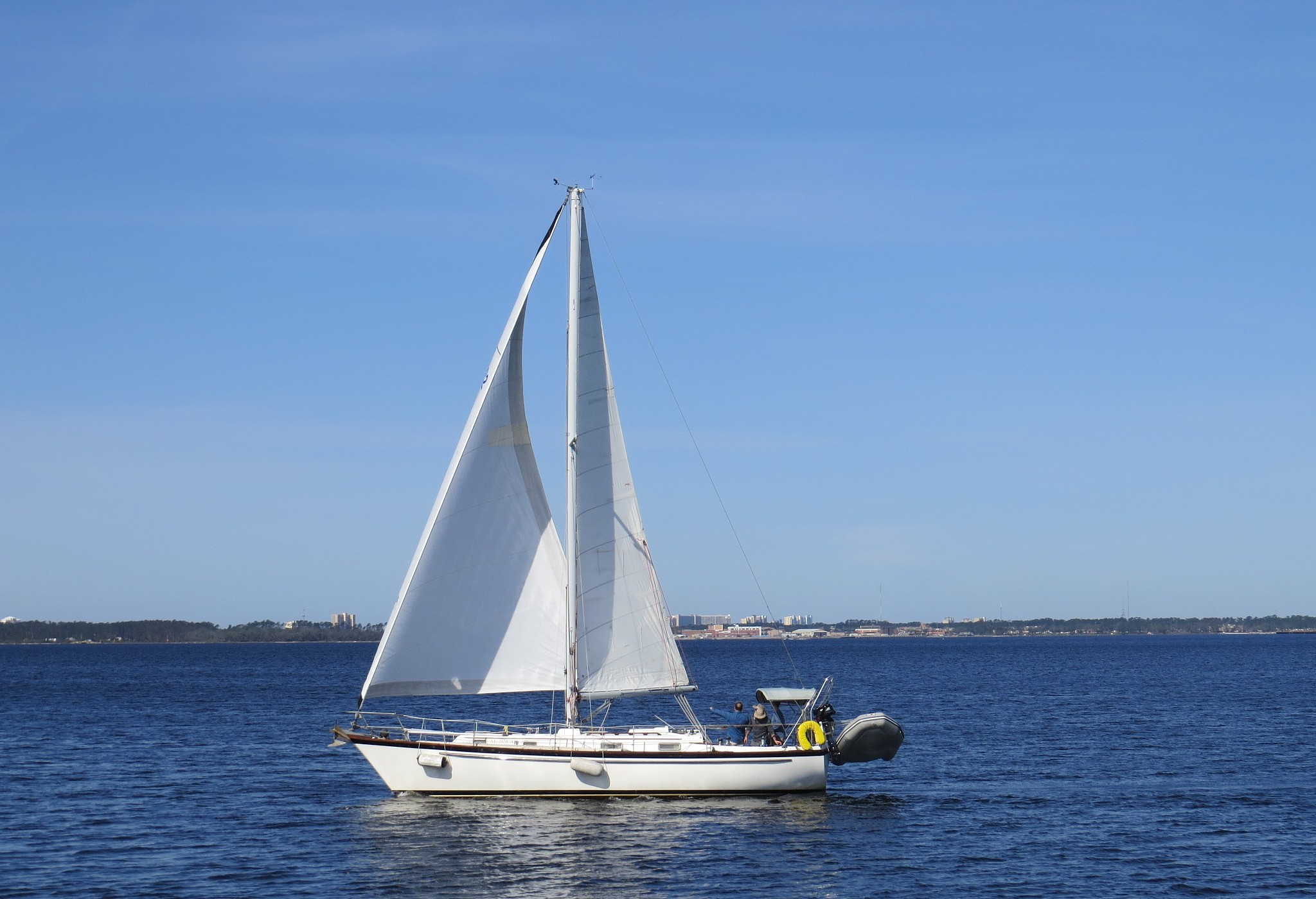 sailboat sailing on sea against clear sky