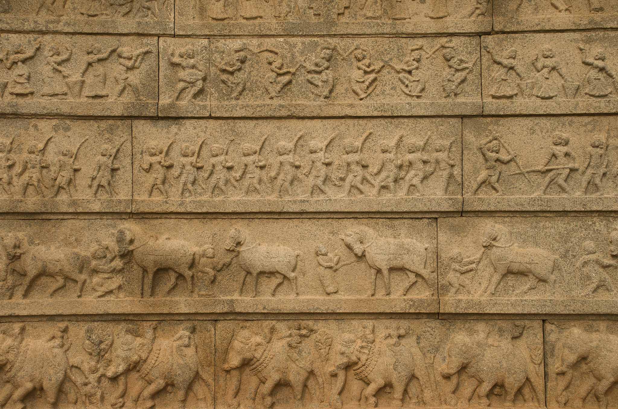 carved ancient figures in hampi ruins