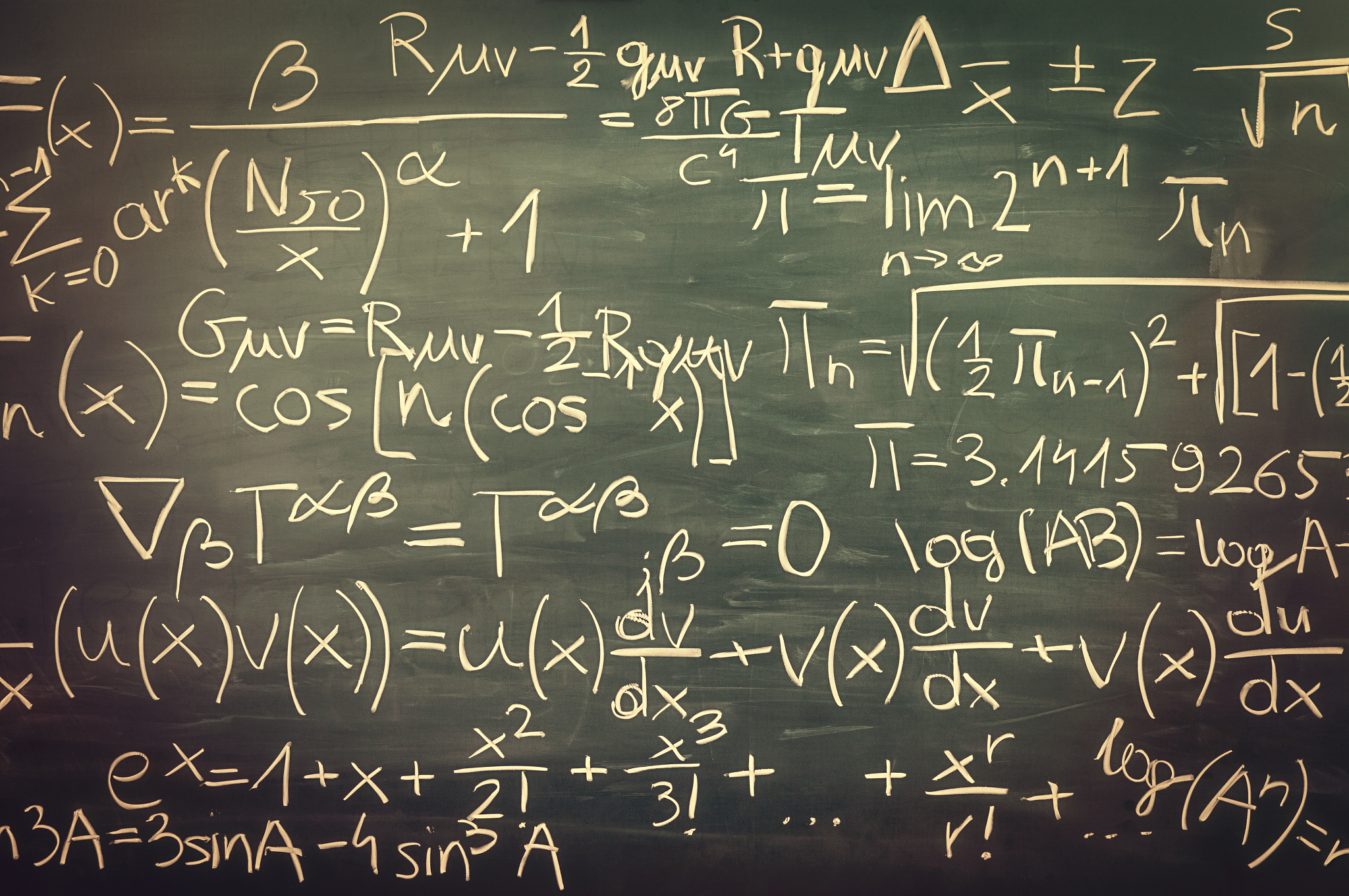 close-up on hand written mixed mathematical formulas, blackboard