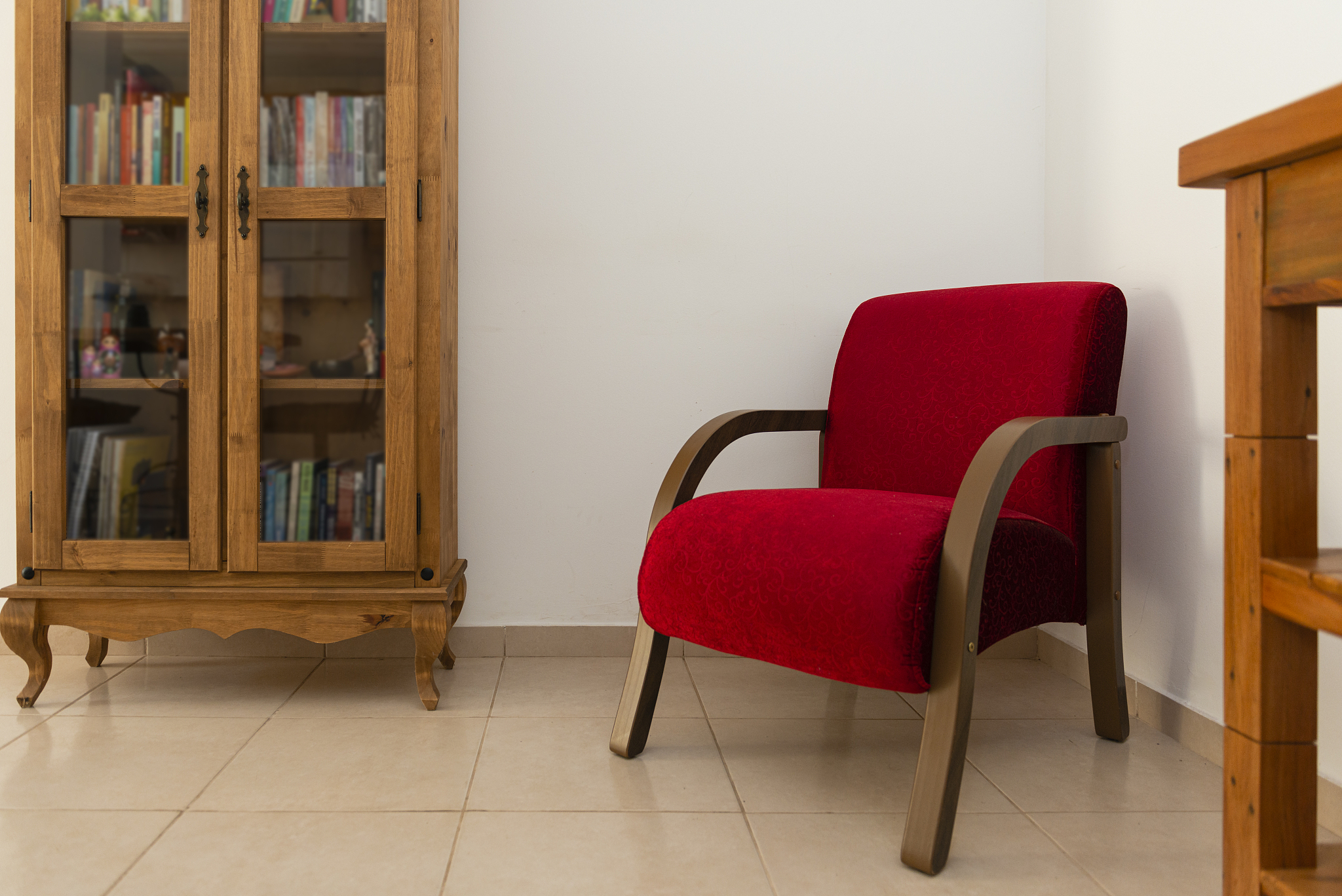 bookcase and armchair in reading room. at home still life