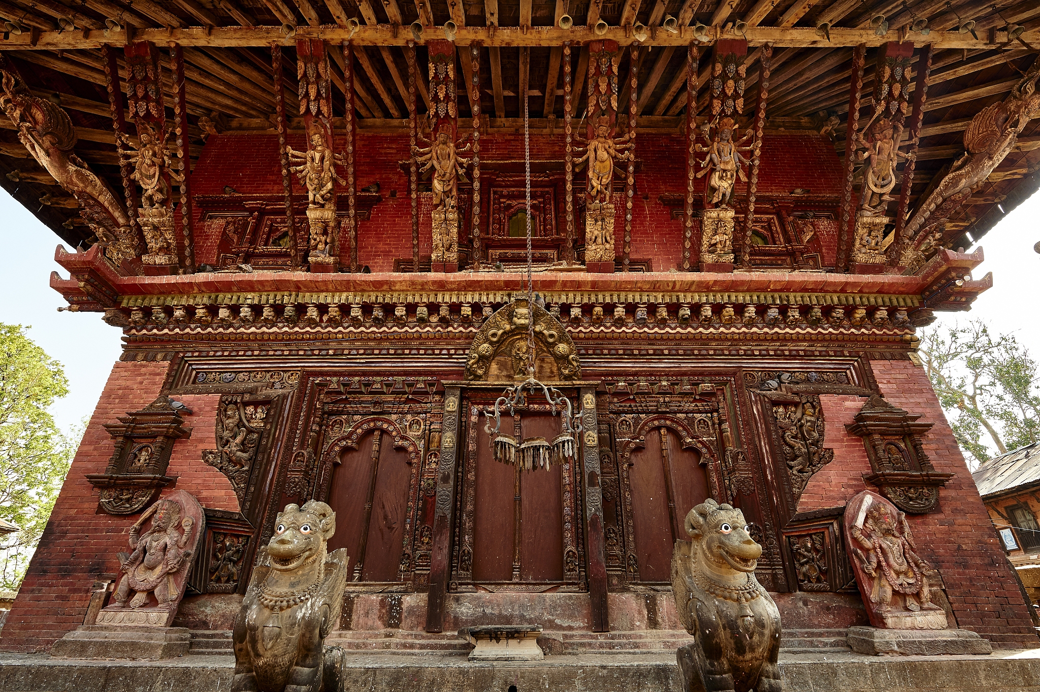 请将以下文本翻译为英文：而存世的古建筑中也有相当部分是寺庙建筑。如现存最早的两座唐代古建均为佛寺殿堂即南禅寺大殿和佛光寺大殿。至于古塔基本都是佛教建筑。 中国的绘画、书法作品同样离不开佛教题材。山水画中有古寺梵刹、阿兰若处；人物画中则有诸佛菩萨、金刚罗汉、高僧大德。而各个朝代抄写的经书则在弘扬佛法的同时为我们保留了大量的古代书法作品。