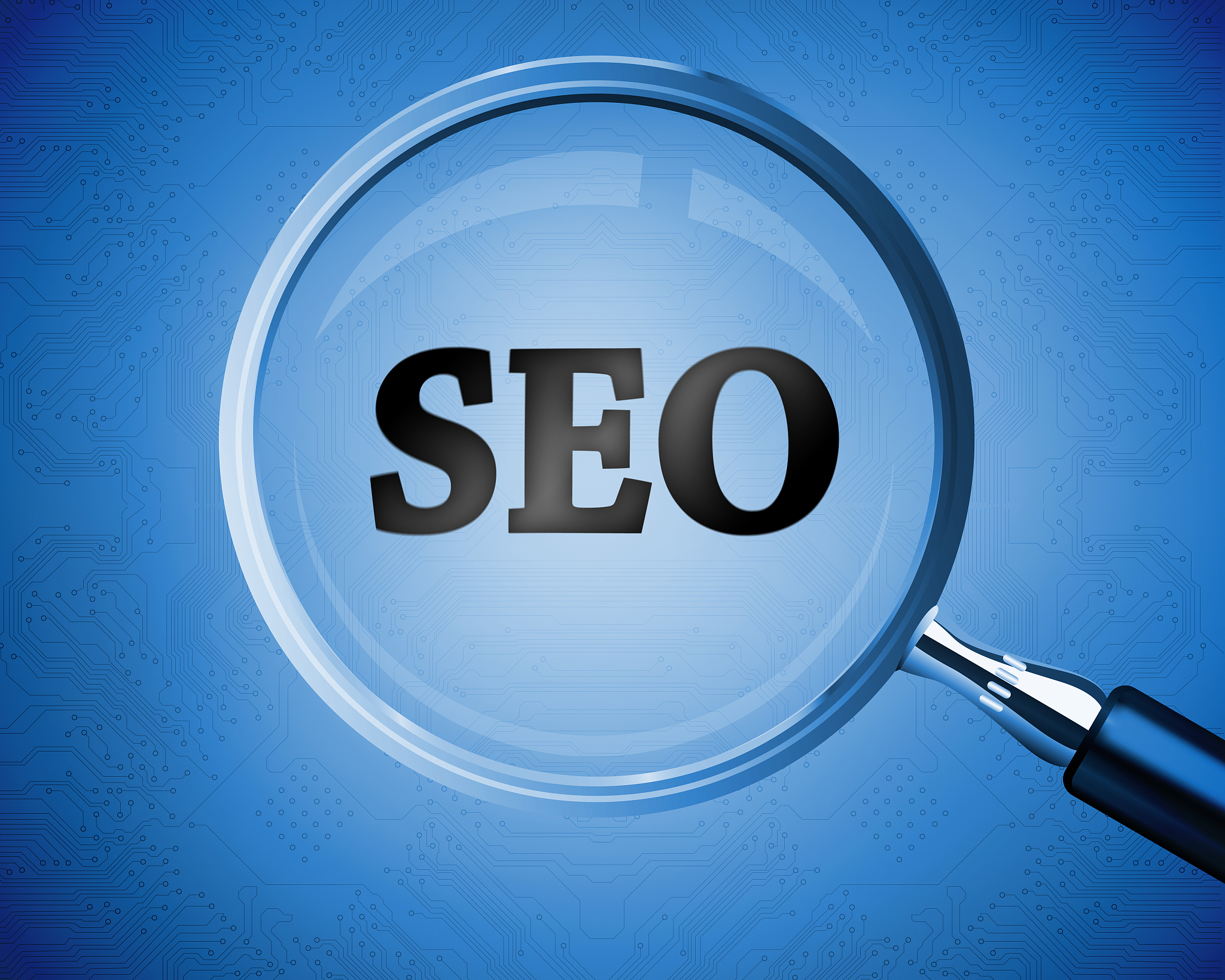 magnifying glass revealing the word seo