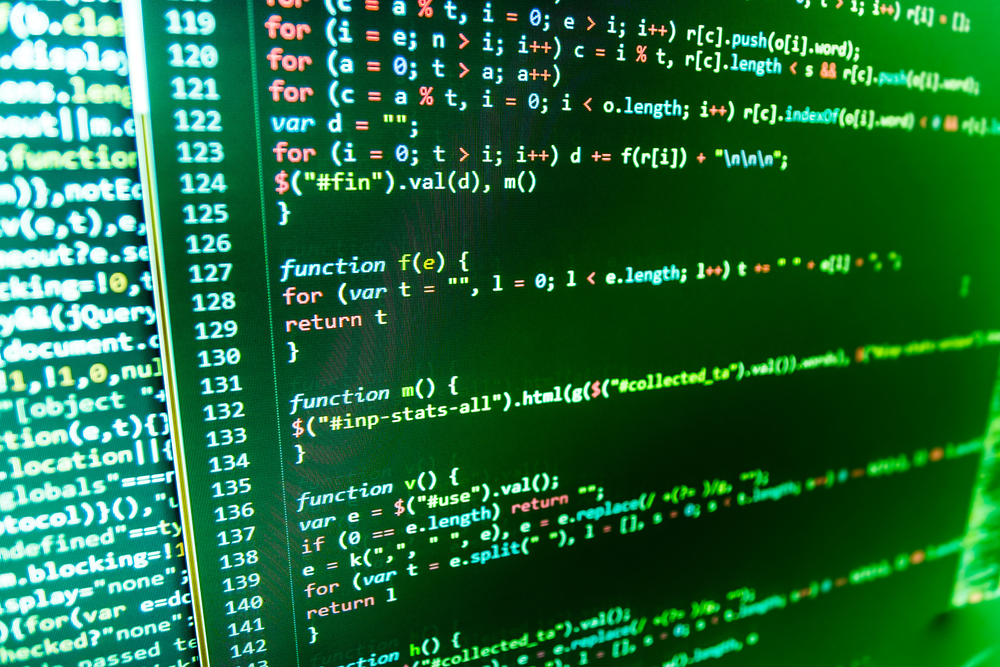 software developer programming code on computer