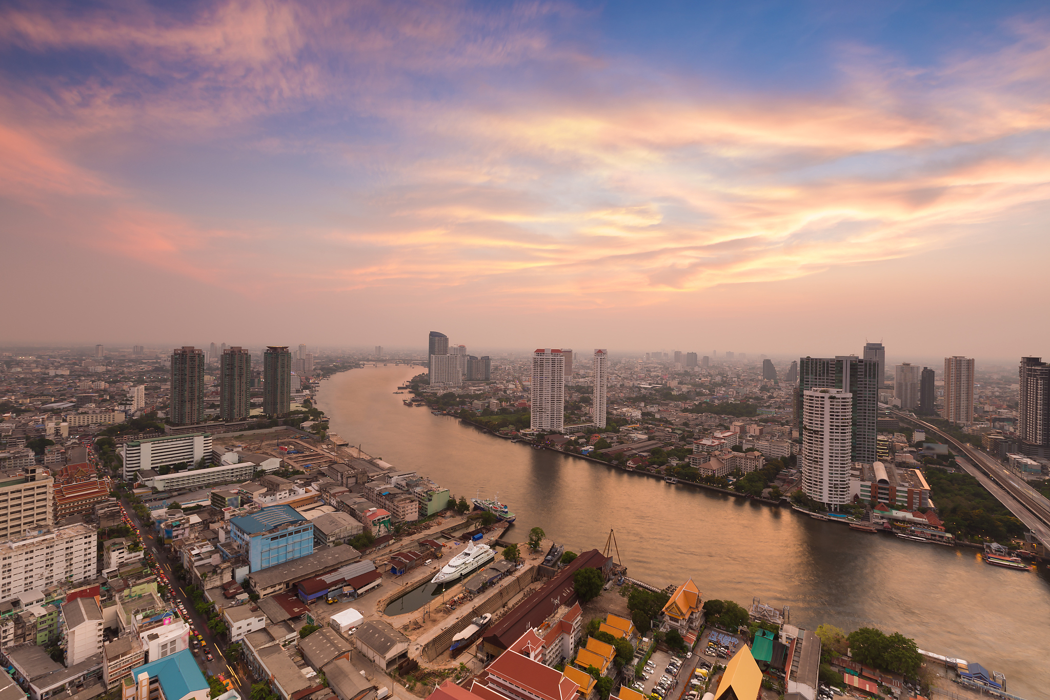river curved in city downtown with beauty of sky