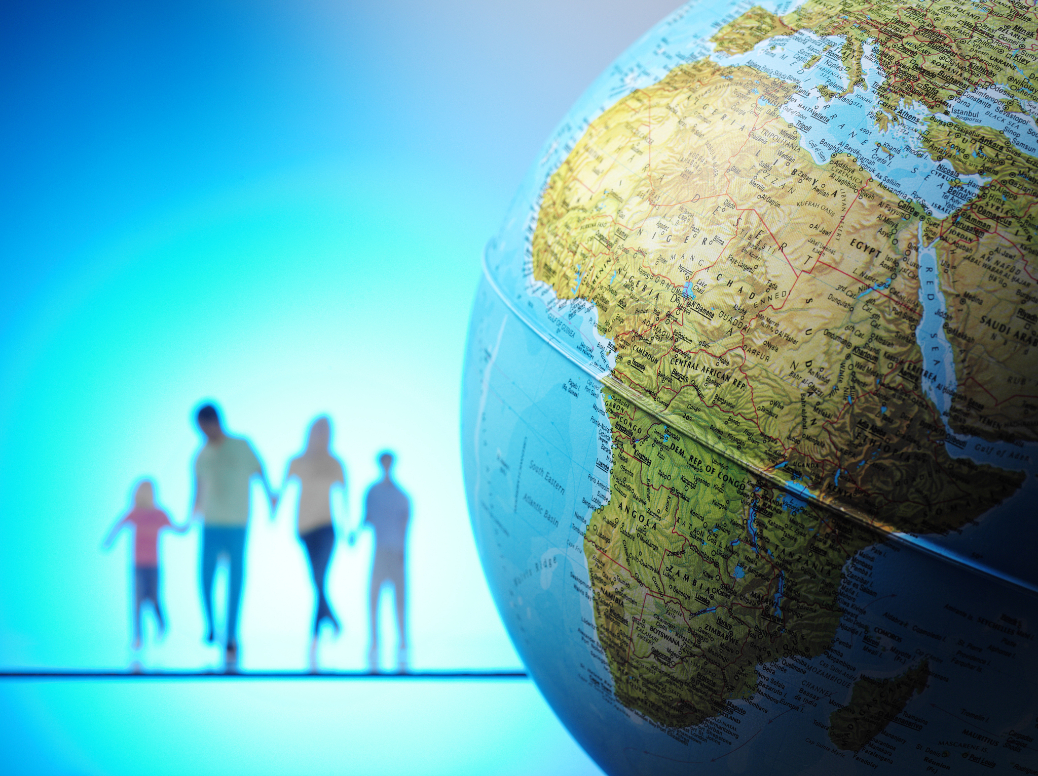 family with africe on a globe