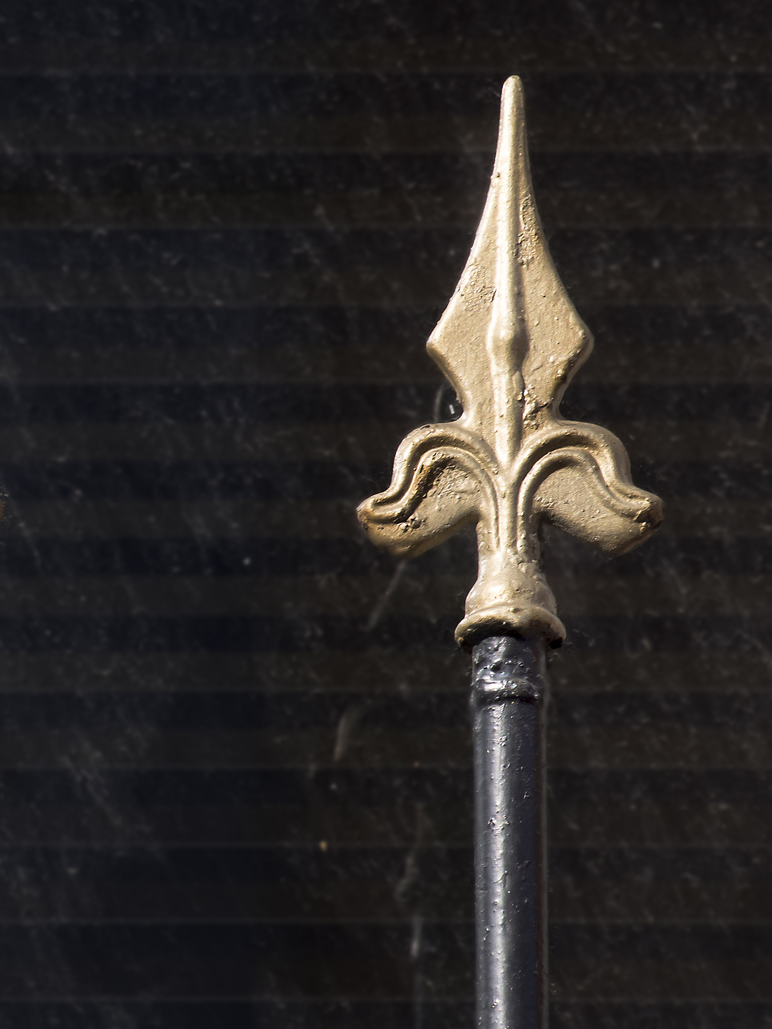 a spear shape golden fence.