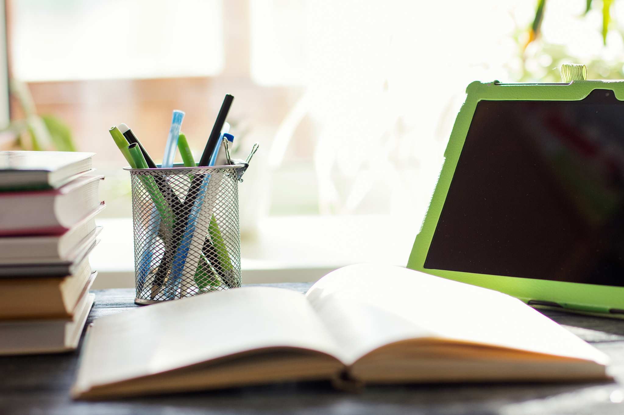 books and pc tablet on the table.
