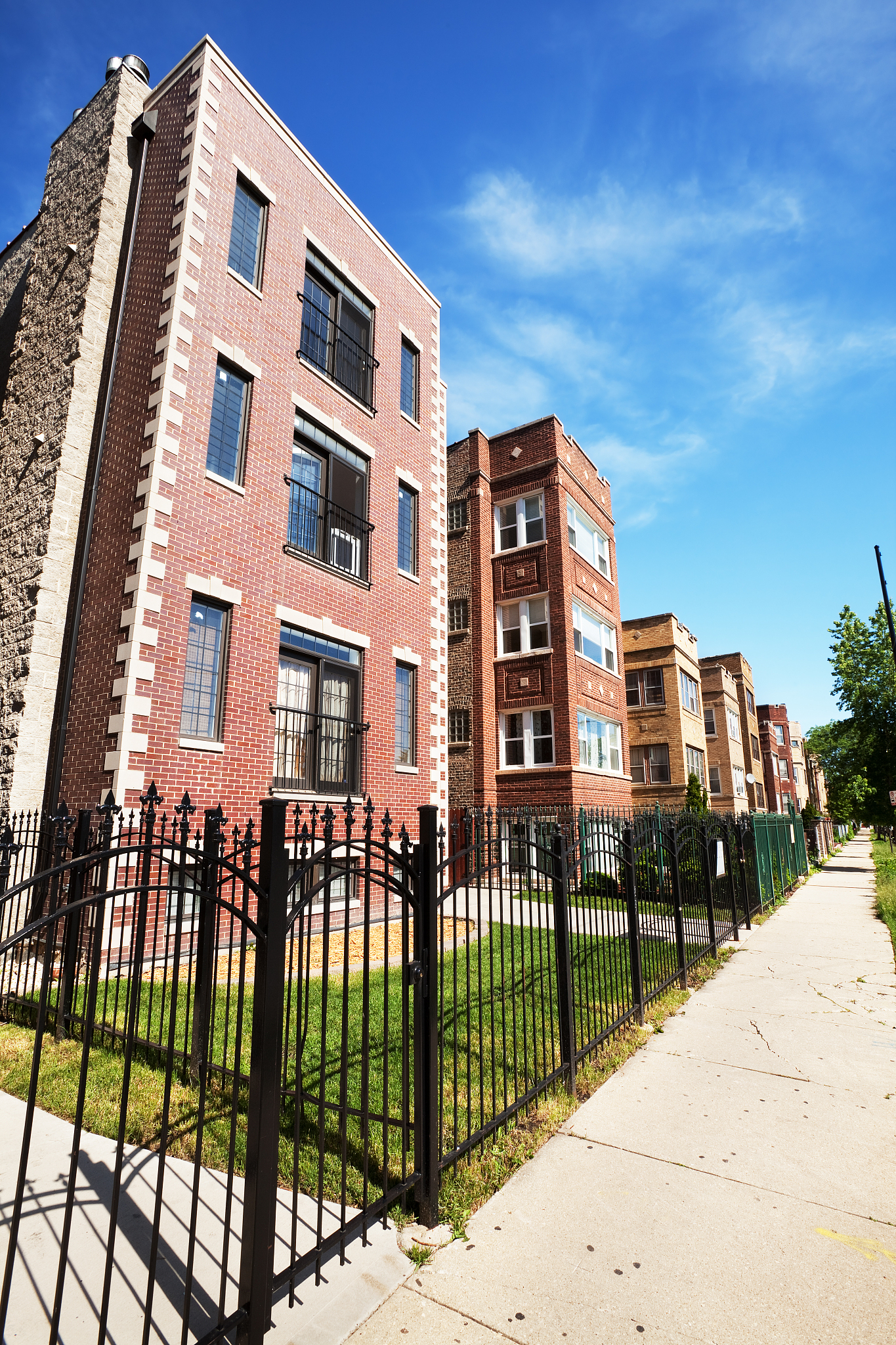 residential street with apartment buildings in north park, chica