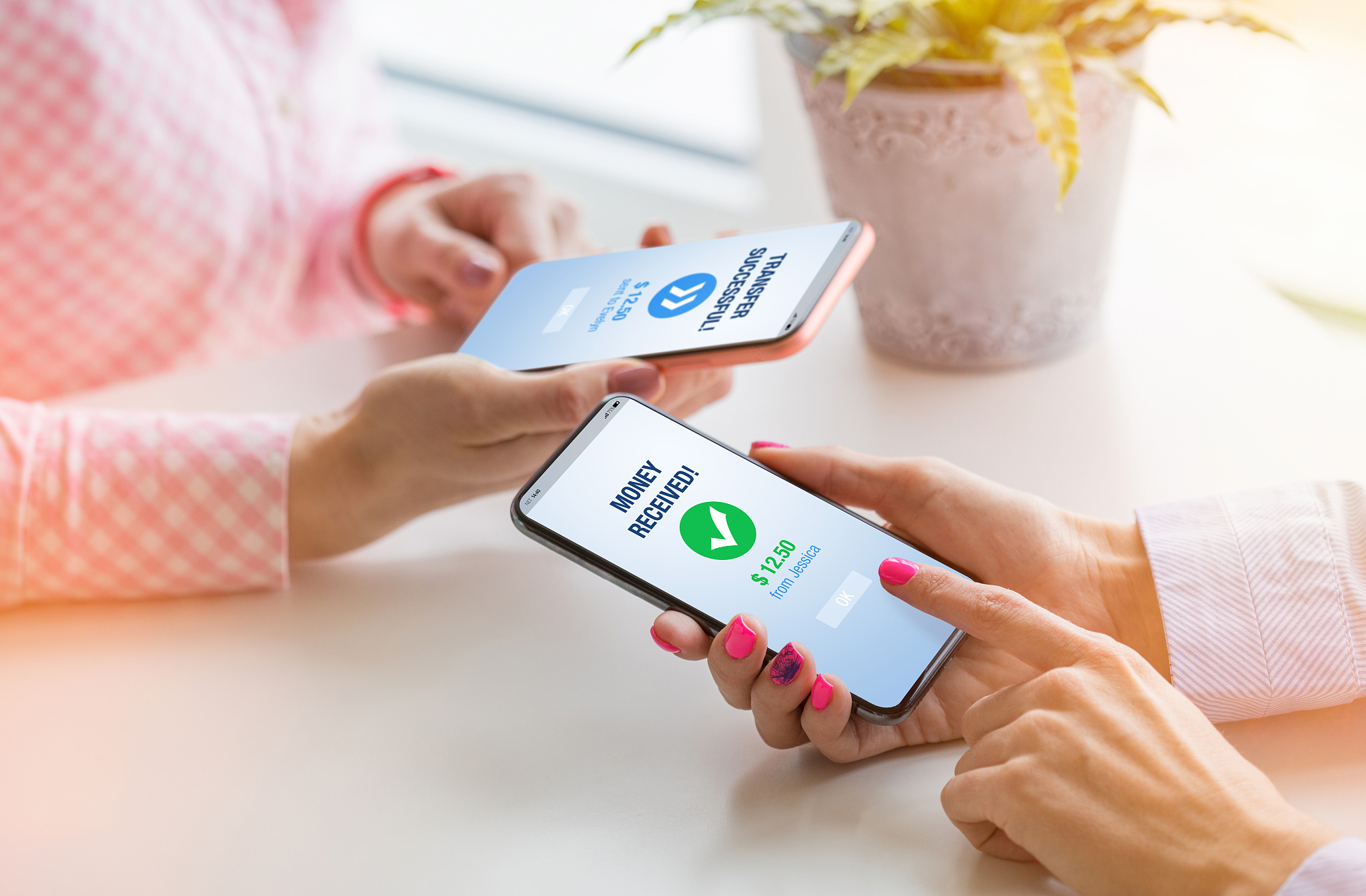 woman sending money to her friend using phone