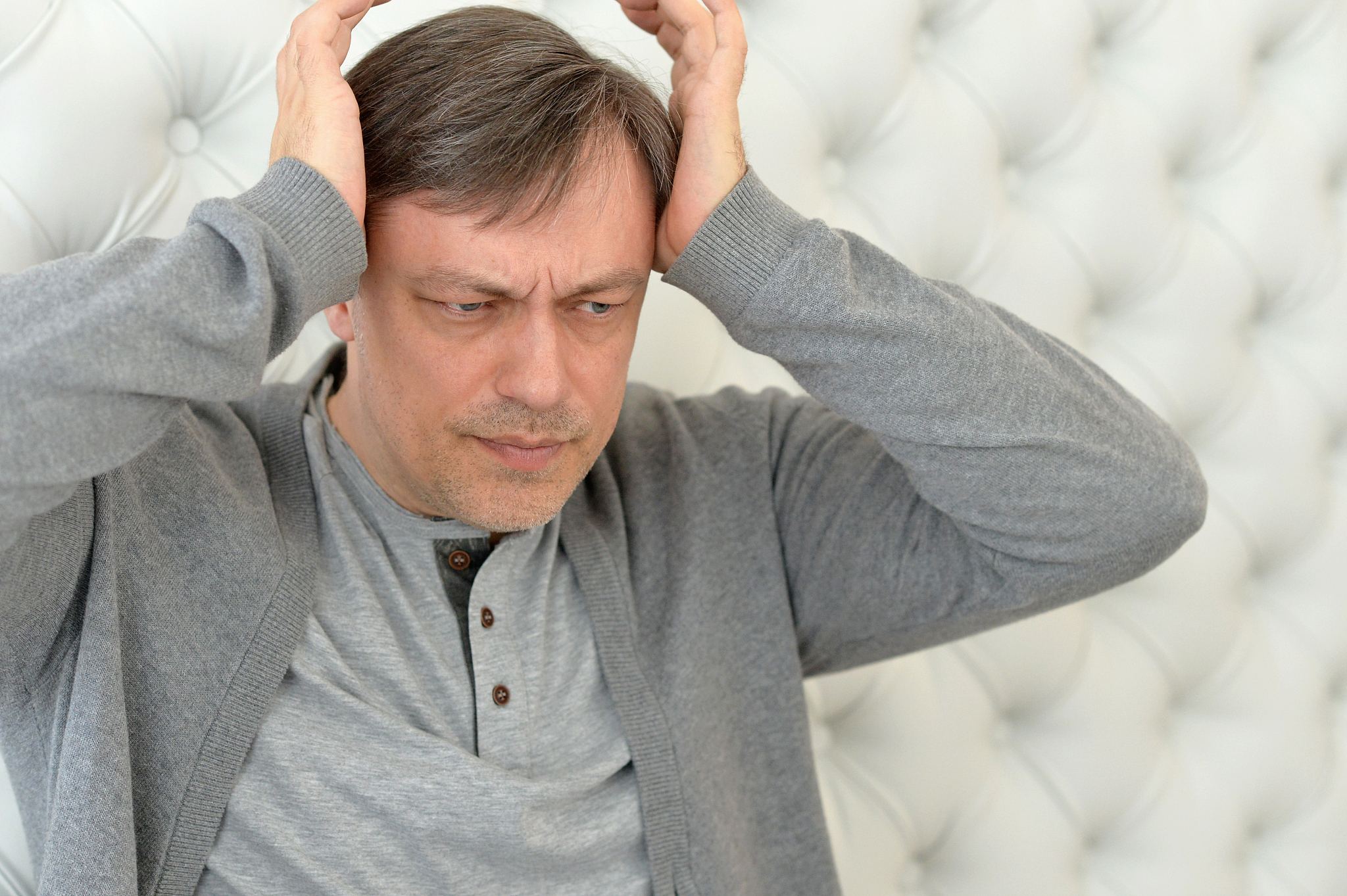 handsome mature man with headache