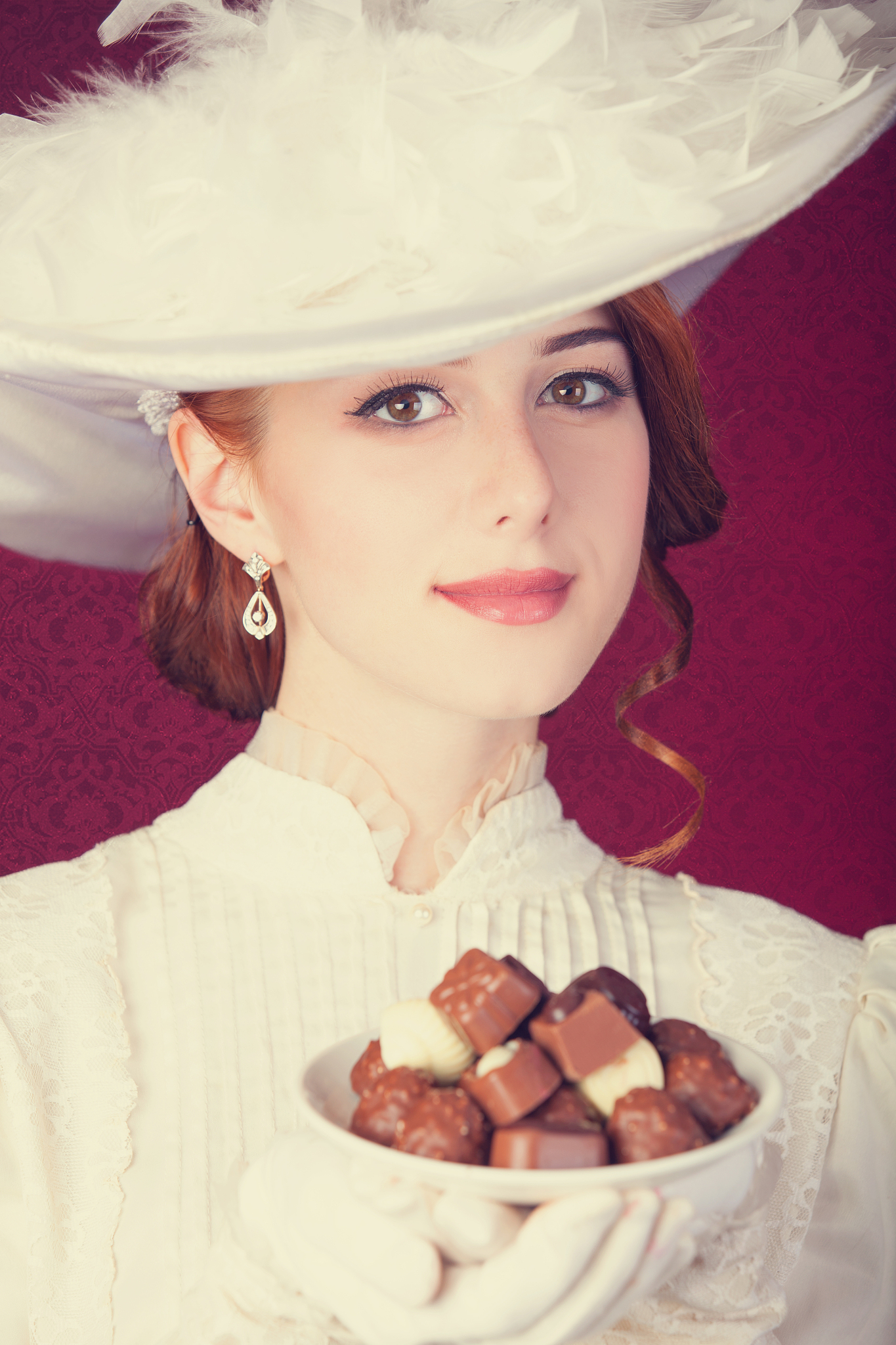 beautiful redhead women with candy.