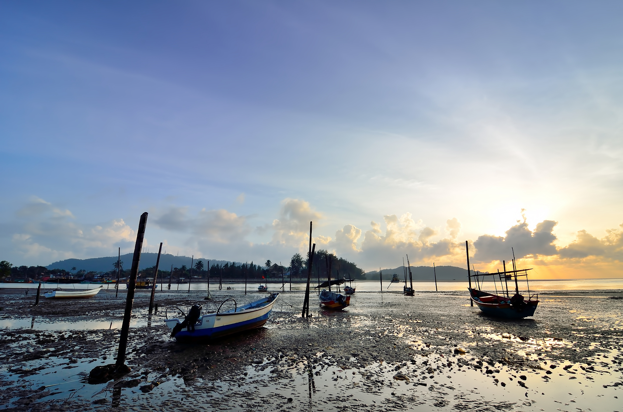 fishing boat on the beach when sun rising up