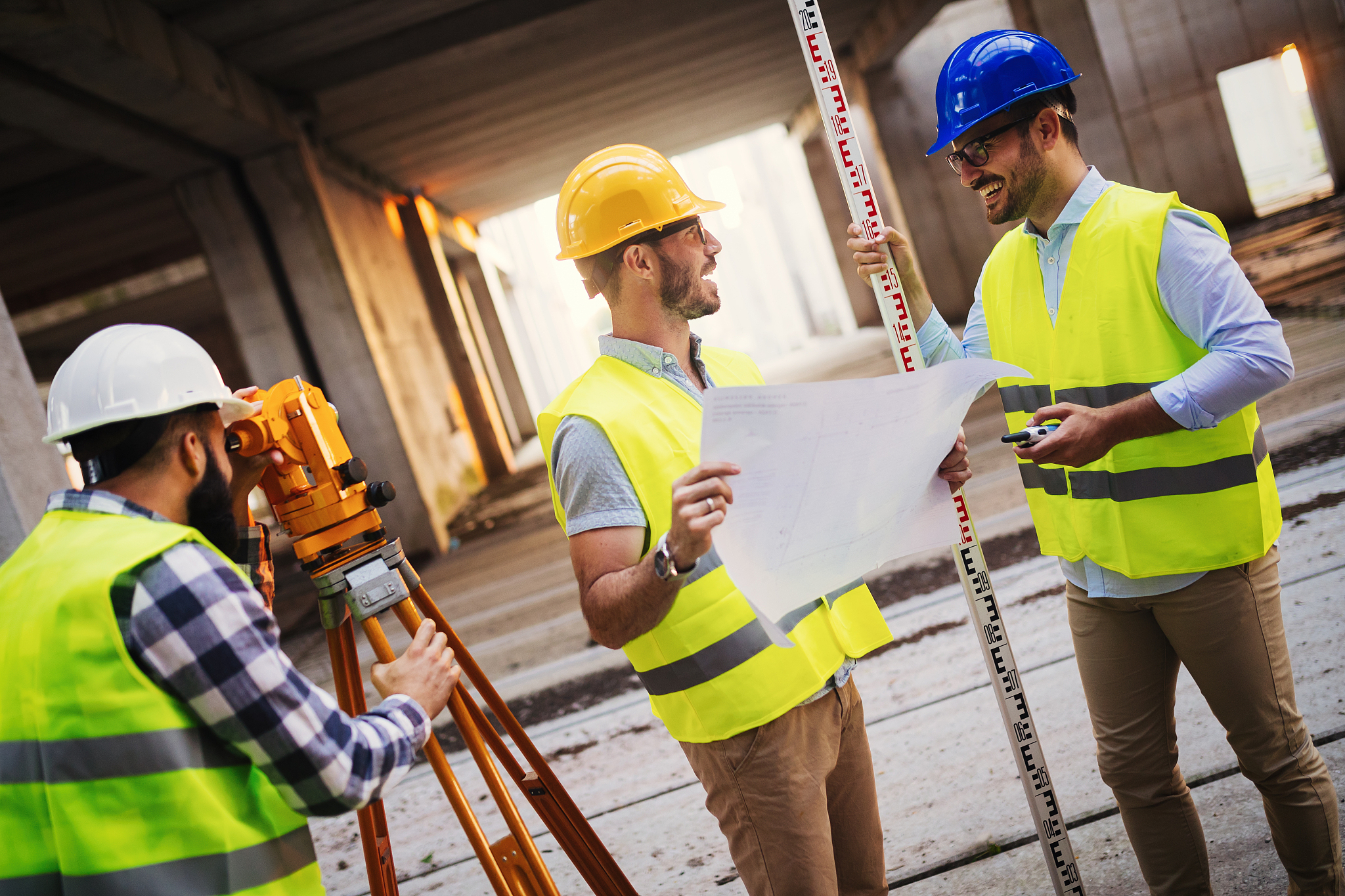 portrait of construction engineers working on building site