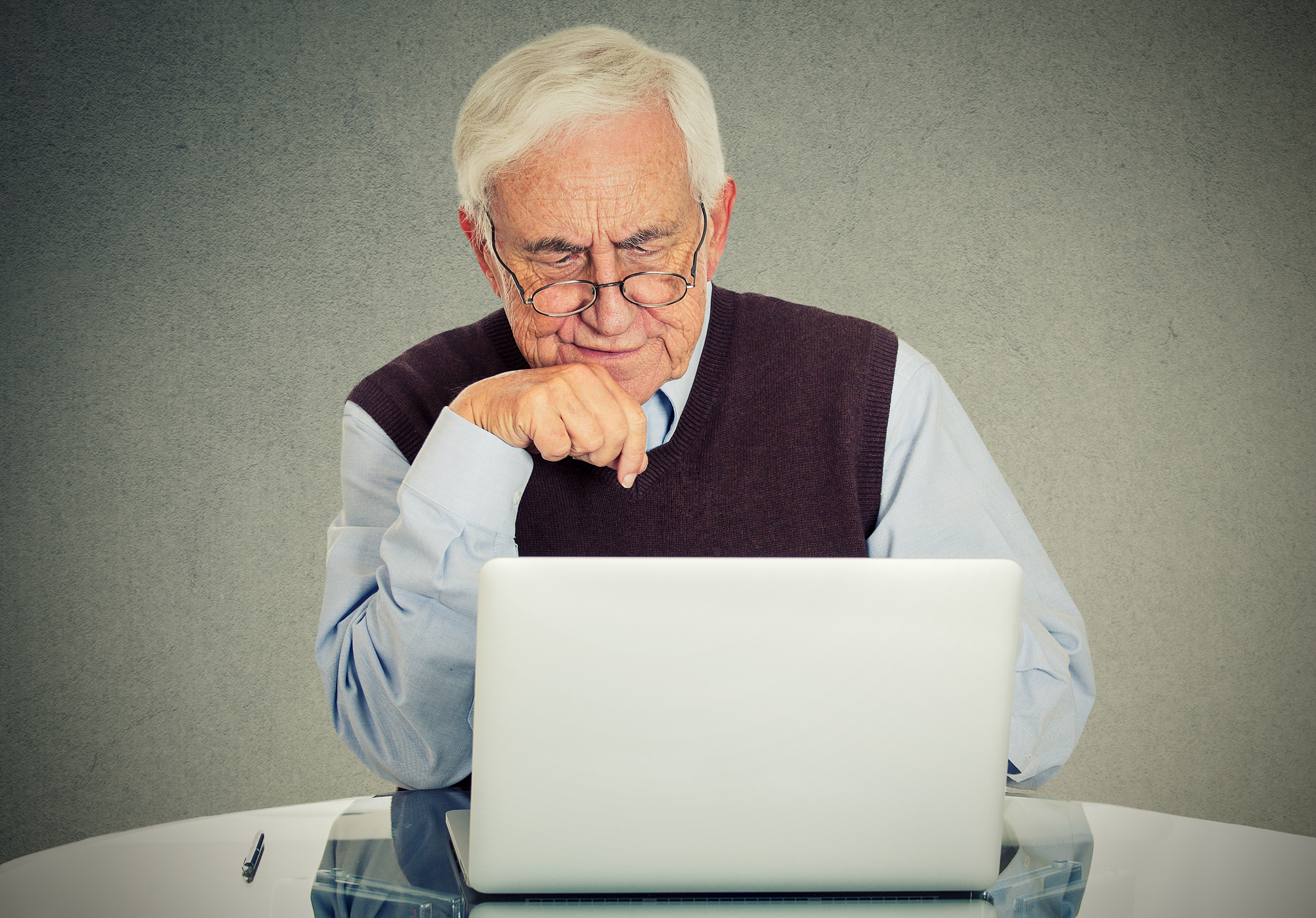 confused grandfather using a pc