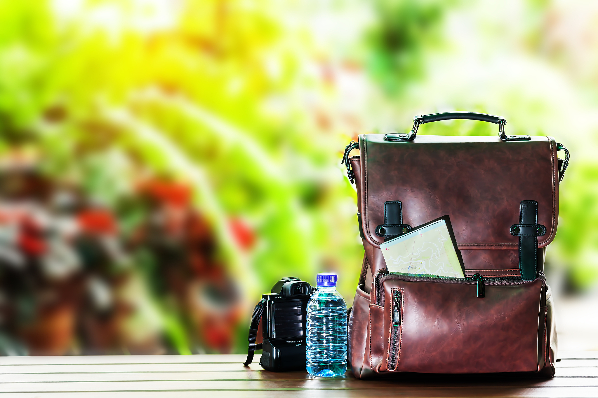close-up of backpack and camera on table