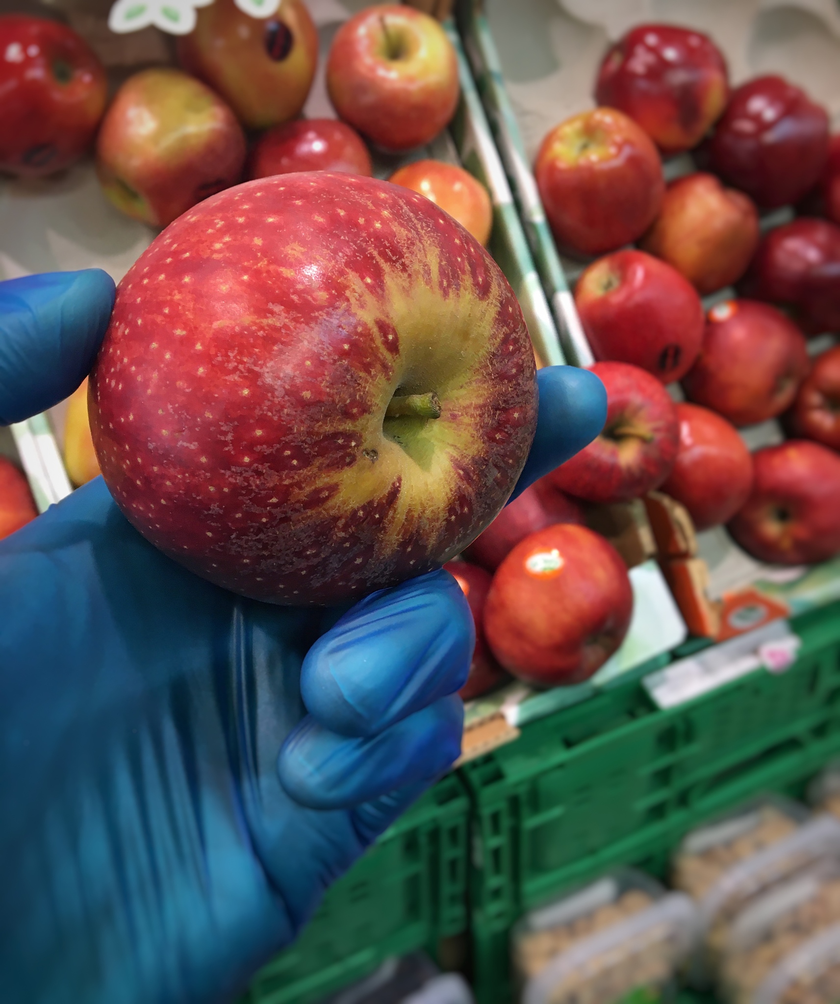 buying apple in pandemic with latex gloves