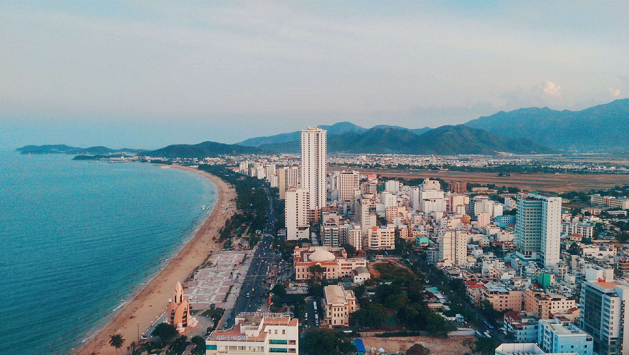 cityscape view with mountain range in background
