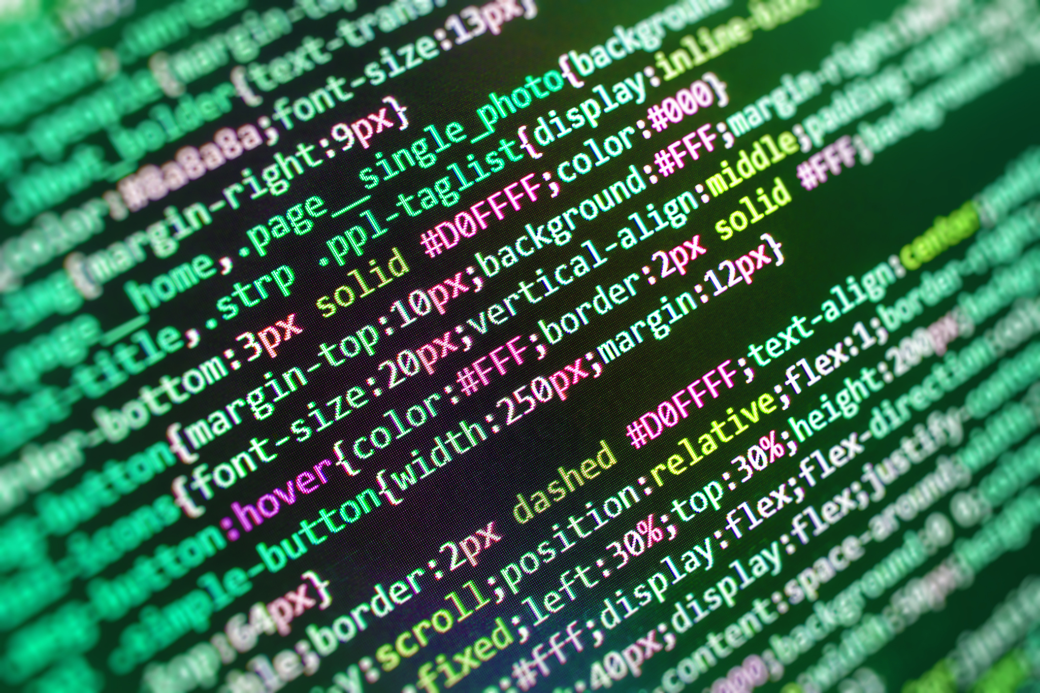 software developer programming code on computer