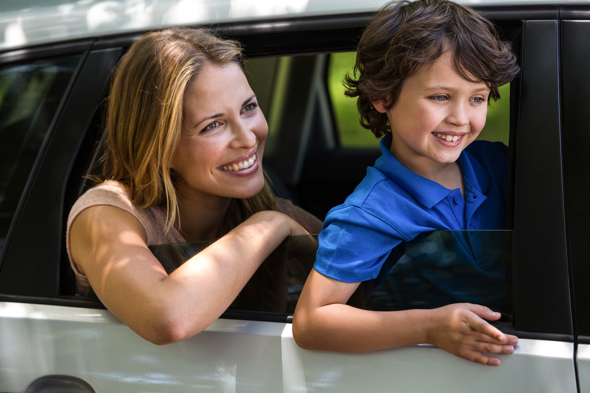 mother and son sitting in a car
