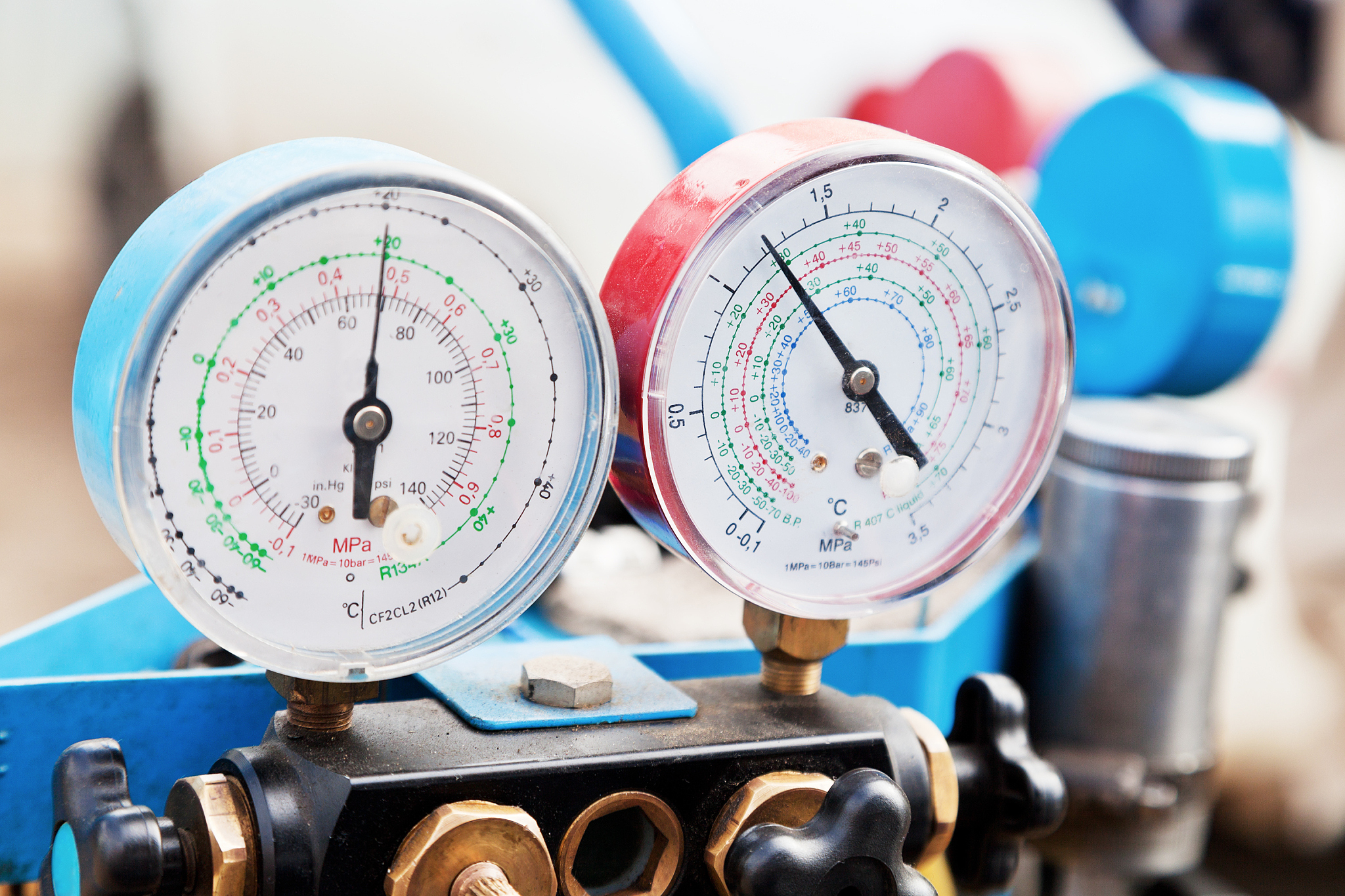 red and blue manometers in a machine shop