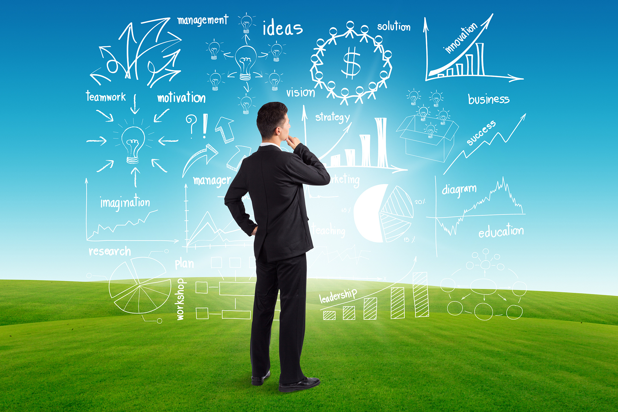 businessman looking to the future creative drawing charts