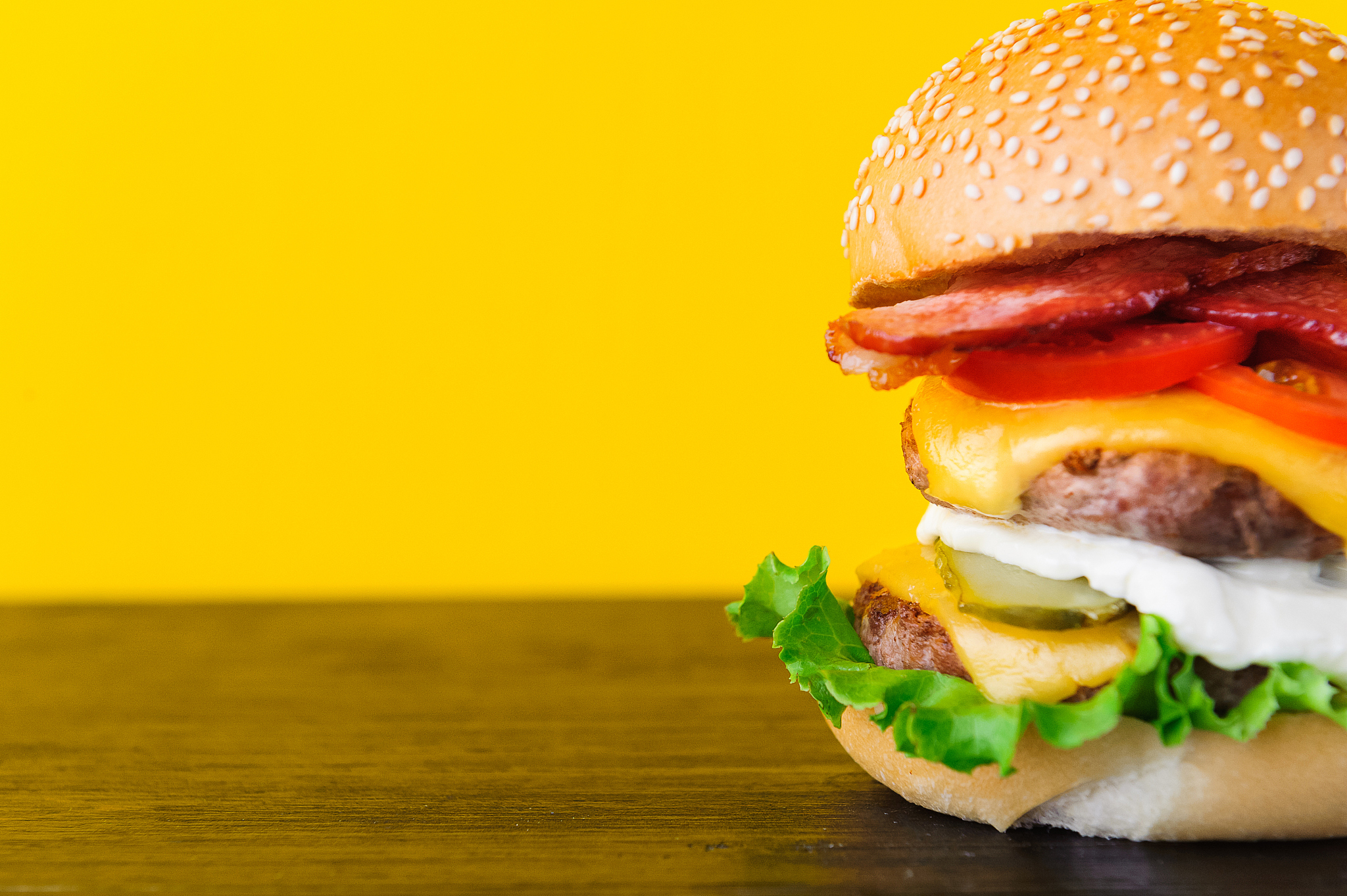 bright juicy appetizing burgers with chops, cheese, marinated cu