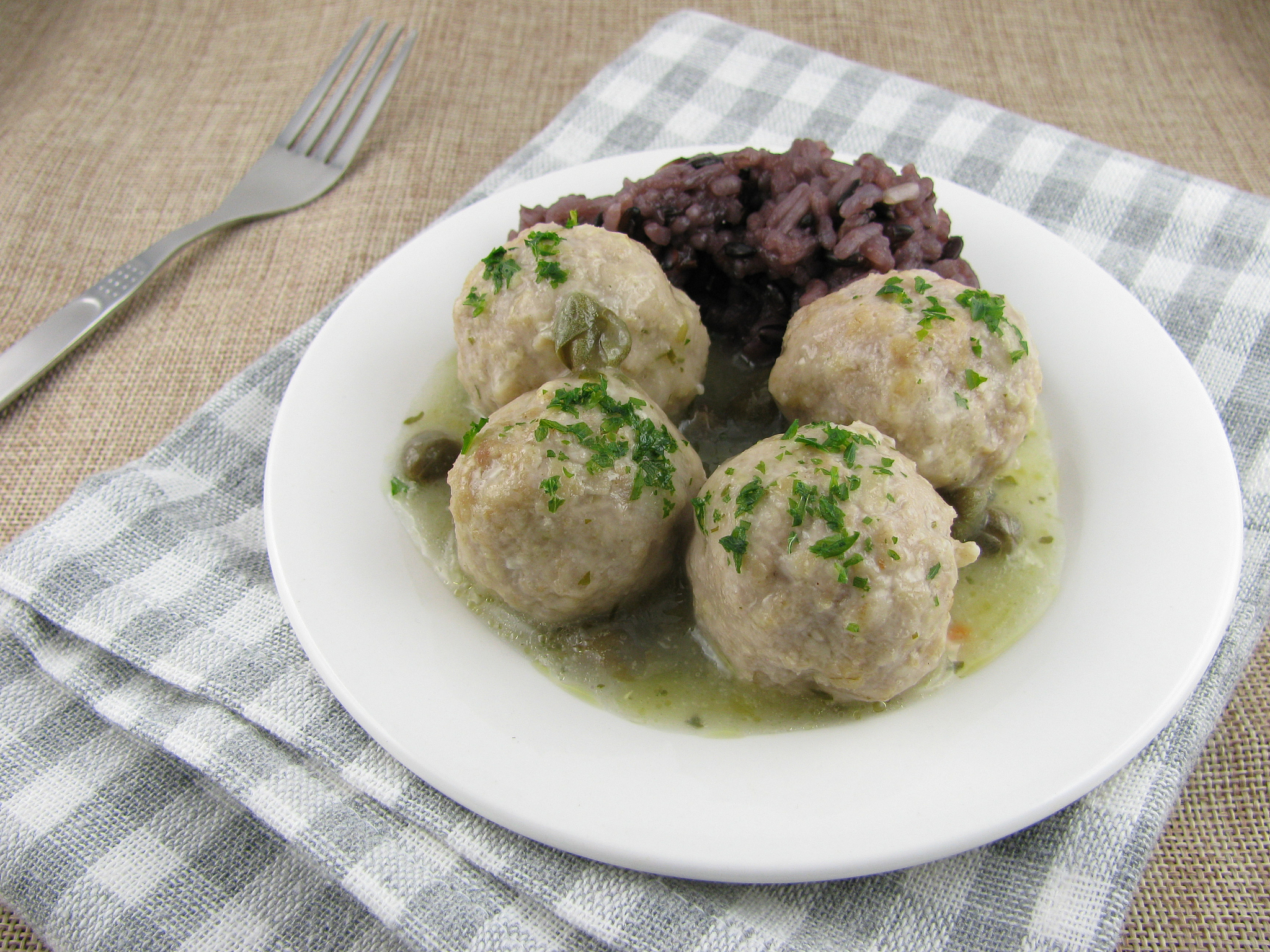 lunch variation of meatballs, caper sauce and rice