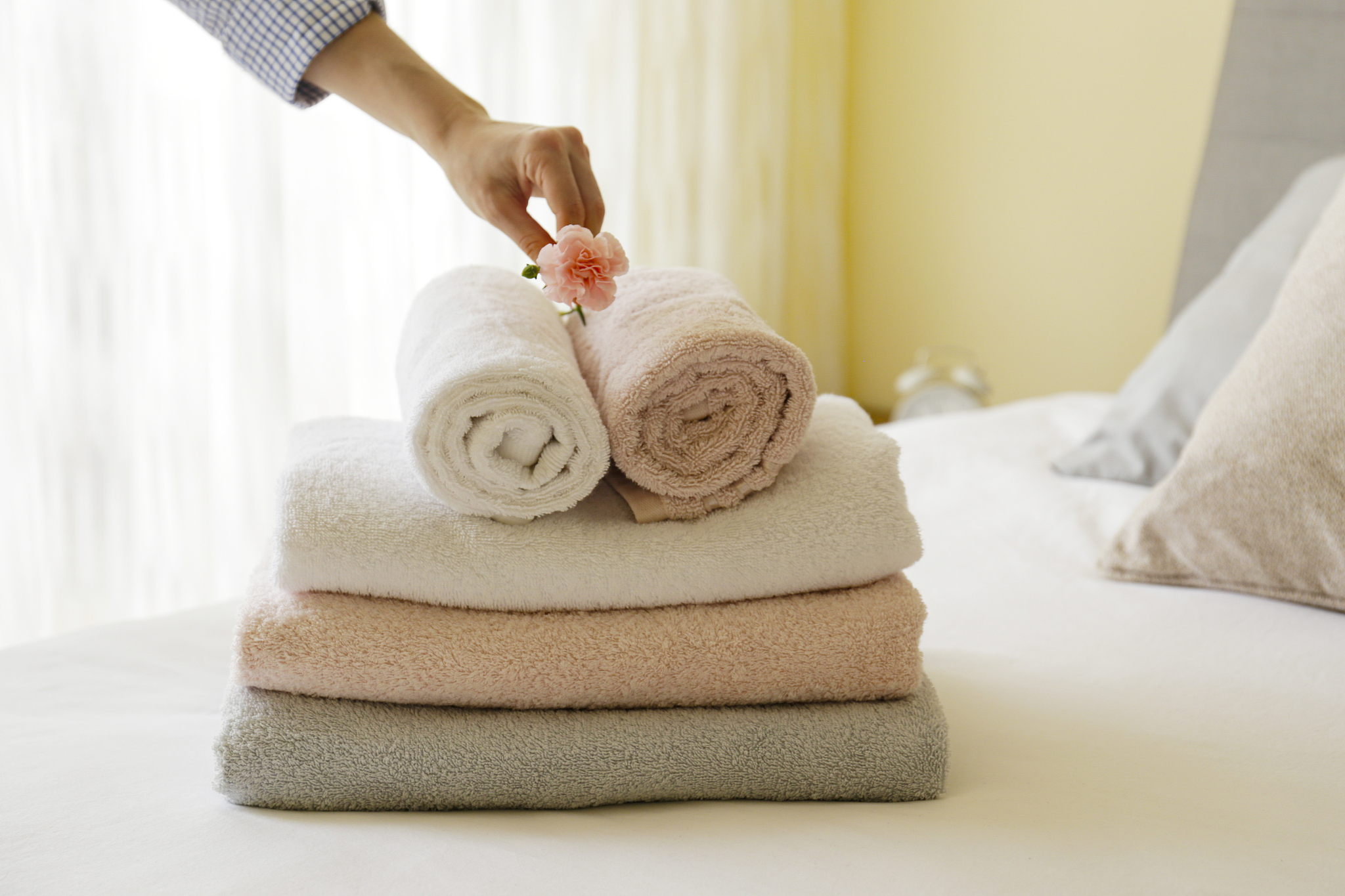 close up shot of freshly laundered bath accessories of different
