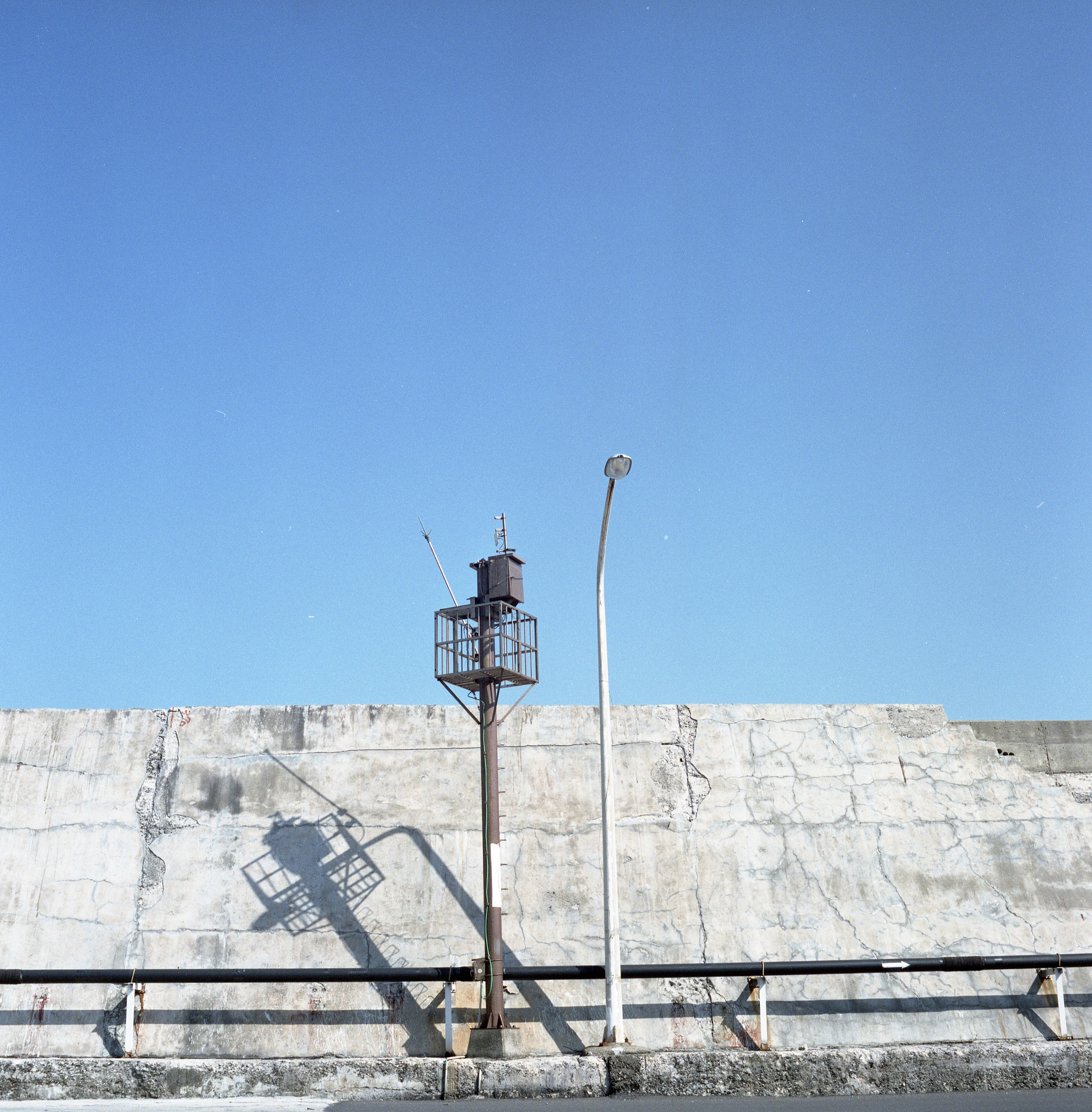 low angle view of street light against wall