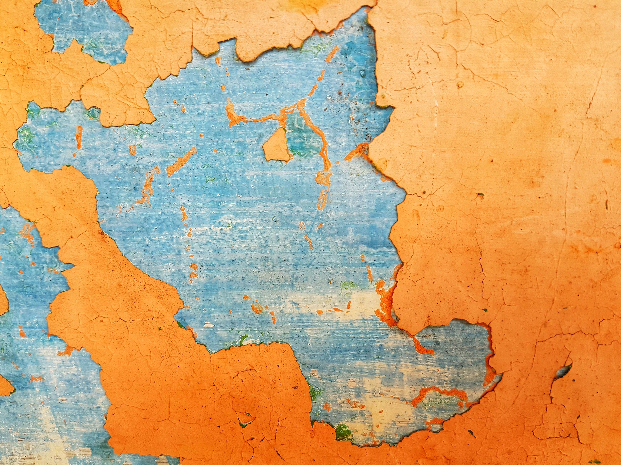 close-up of peeling orange walls