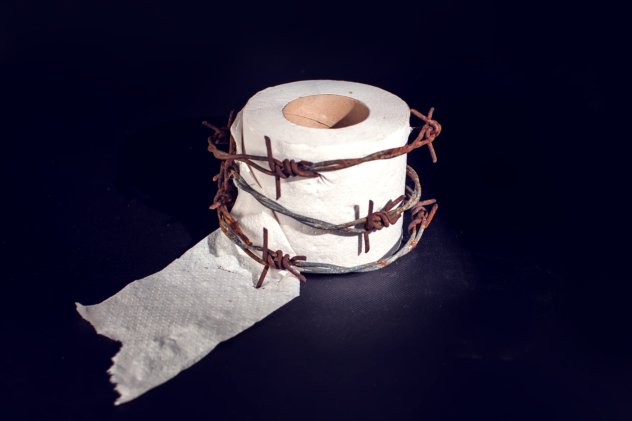 toilet paper with barbed wire around it. people, healthcare and 