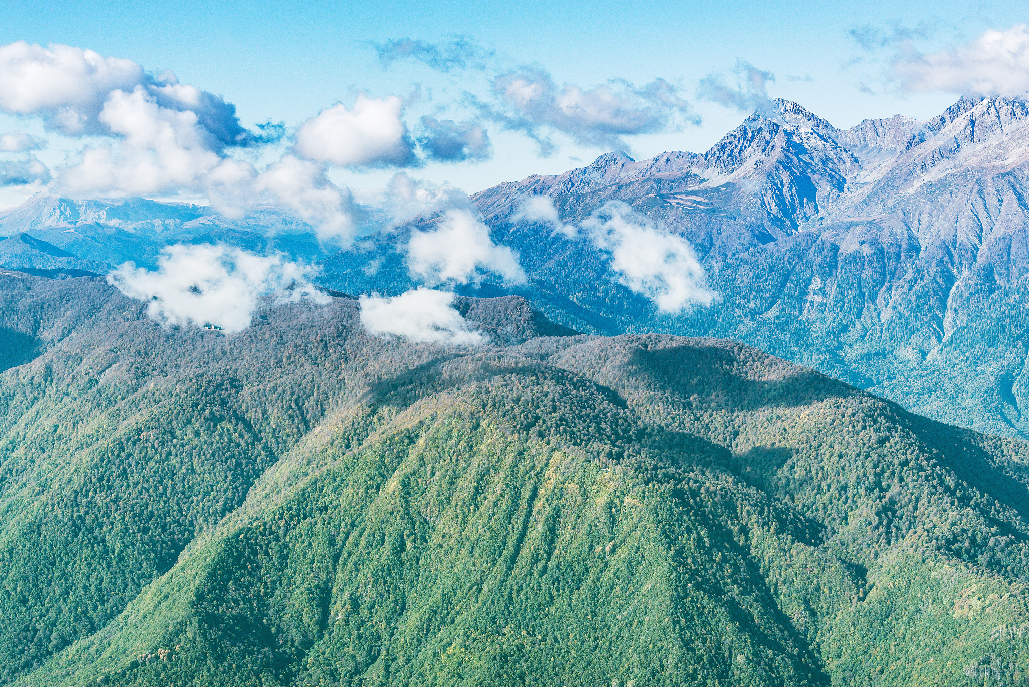 caucasus mountains and clouds above at day time. sochi.
