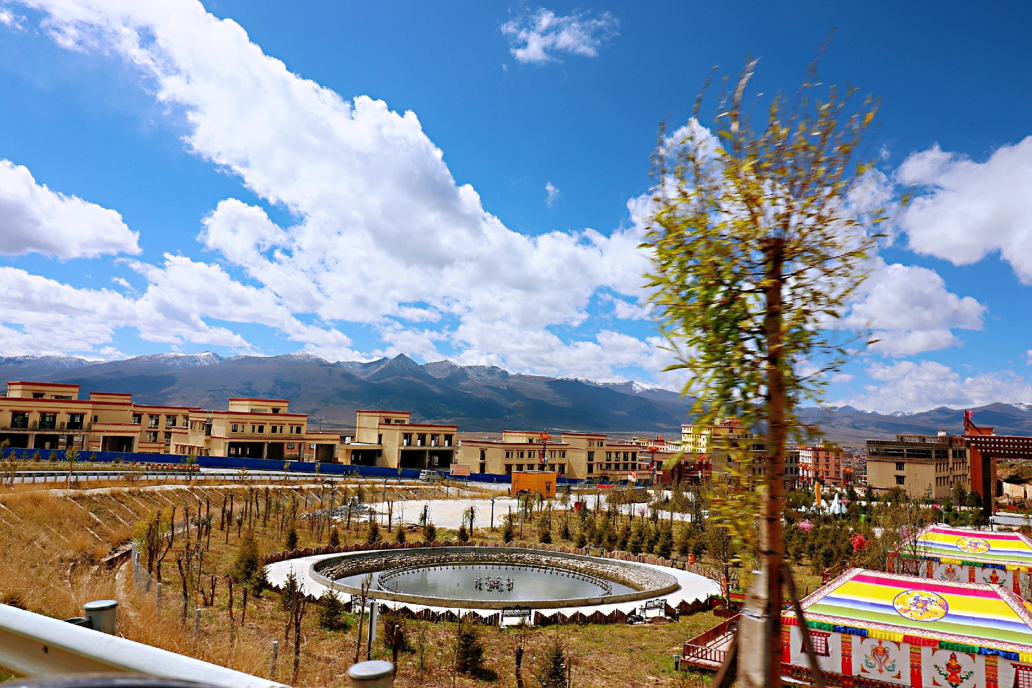 panoramic view of buildings in city against sky