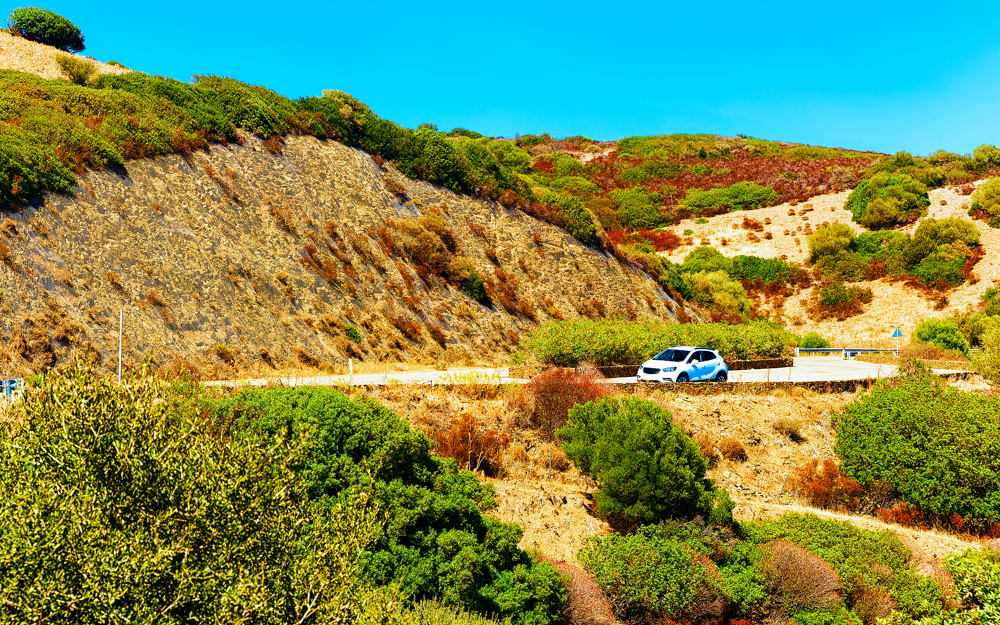 car on road in chia sardinia reflex