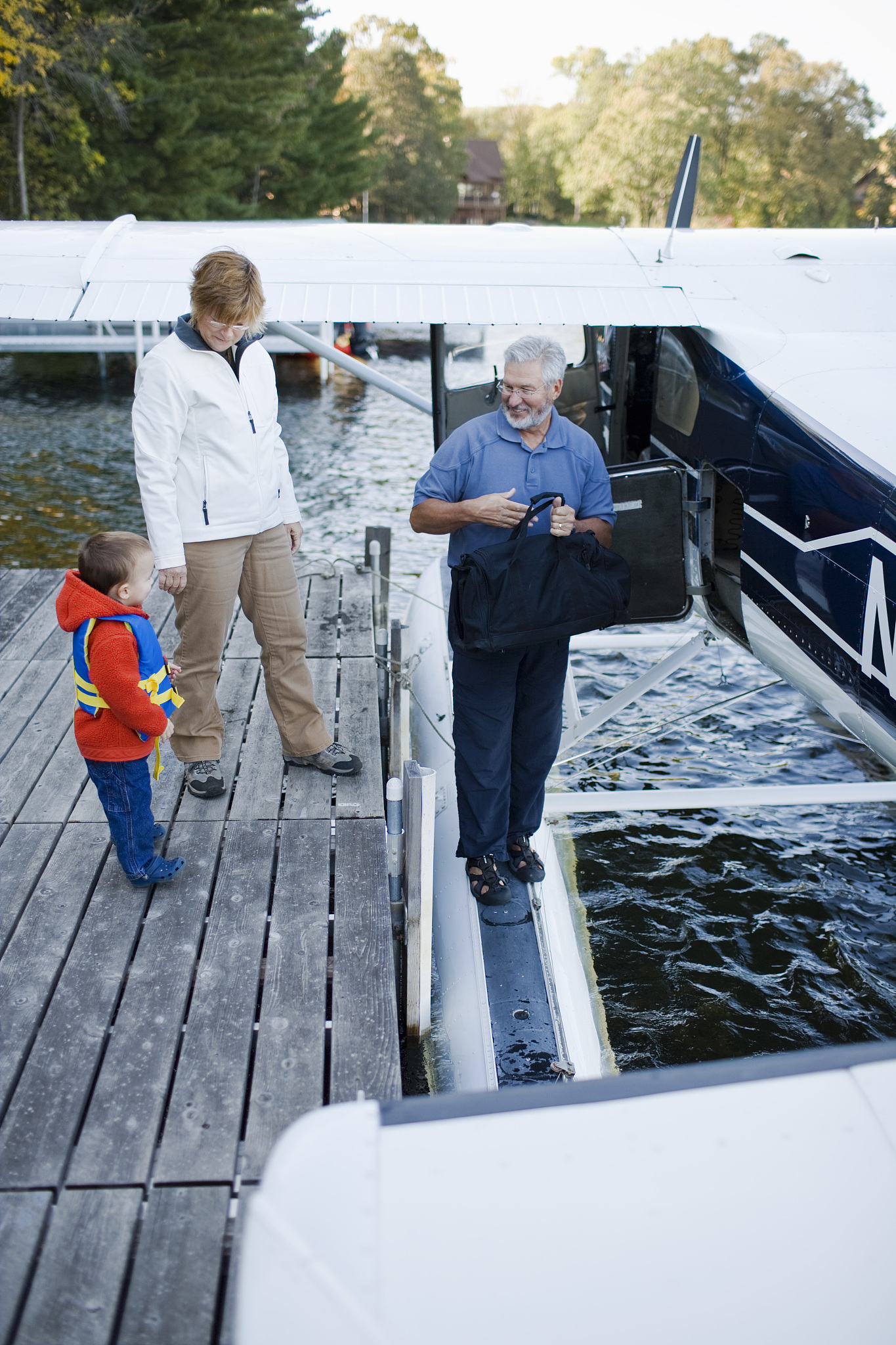 grandparents and grandson with floatplane