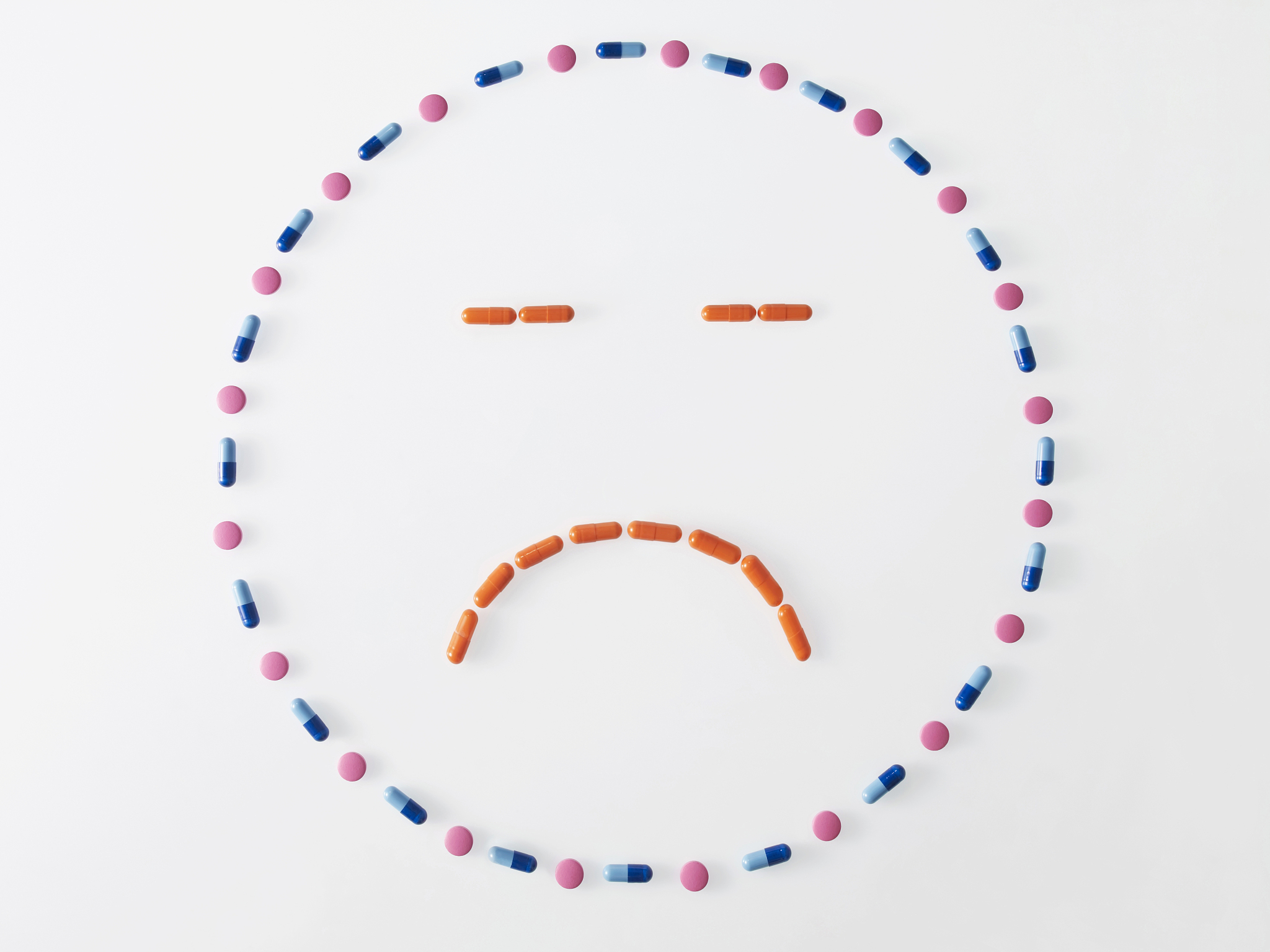 pills forming a sad face