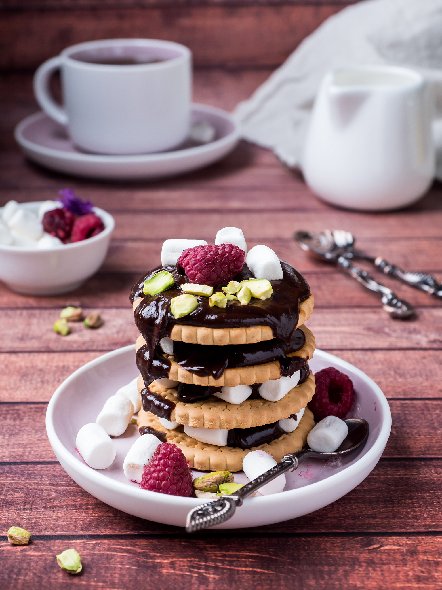 a sweet dessert of chocolate biscuit, raspberry marshmallow and 
