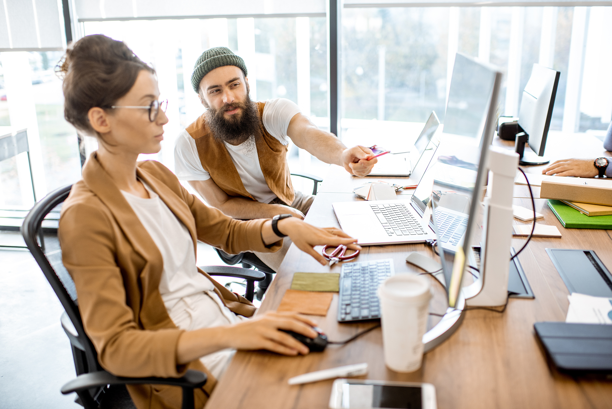 creative man and woman working in the office