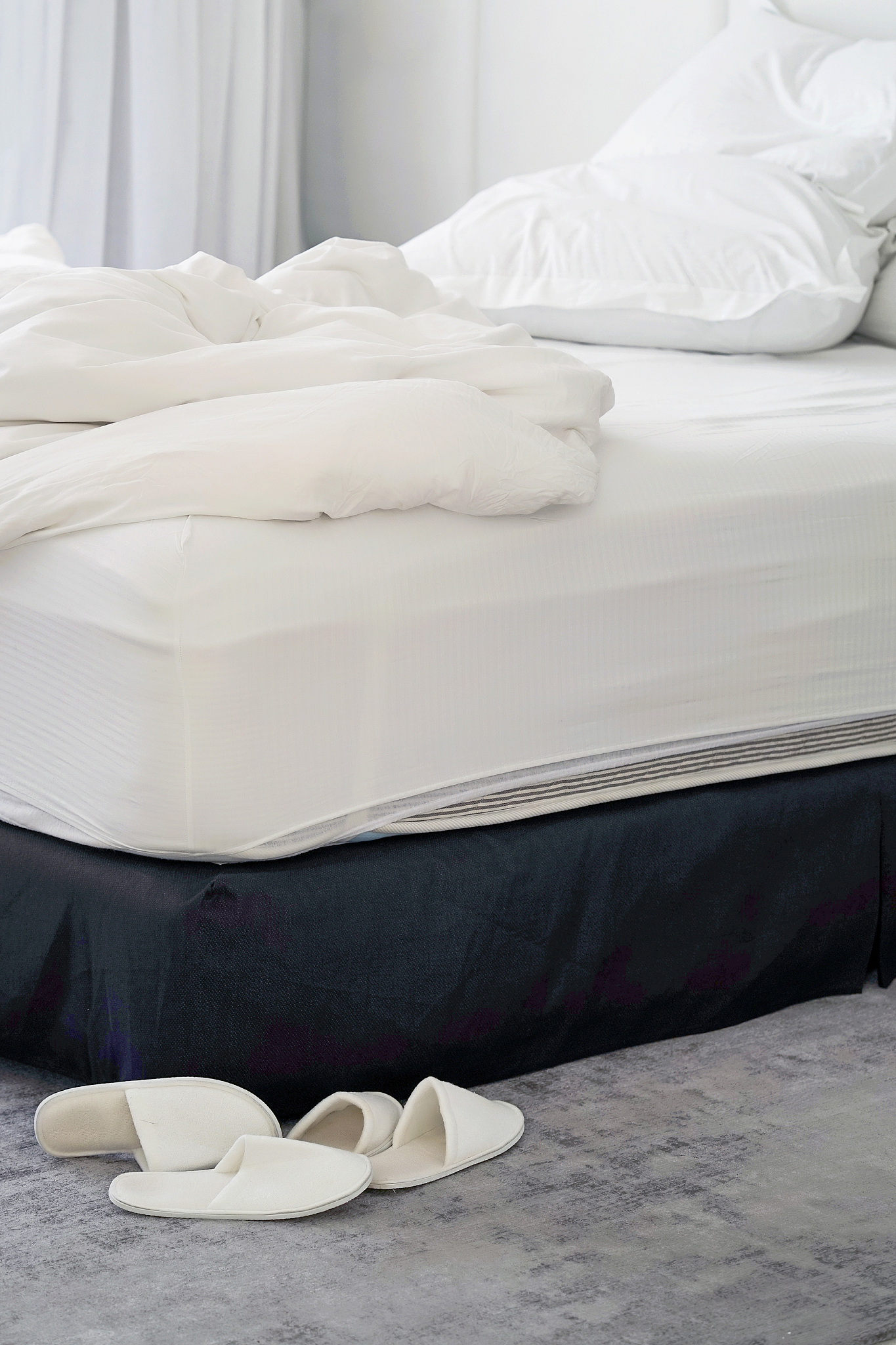 hotel bed after use. dirty bed pillow blanket room.