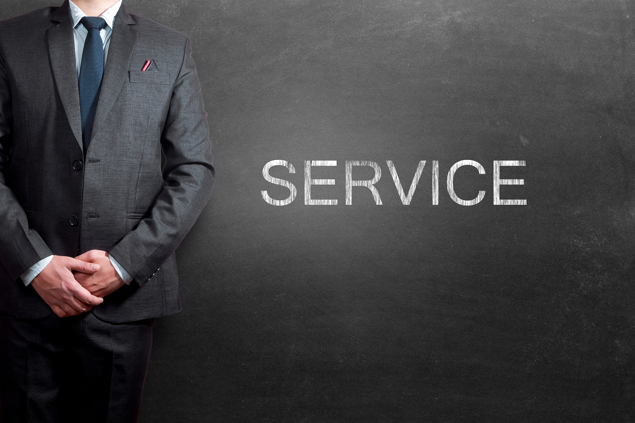 concept of service written on blackboard with businessman