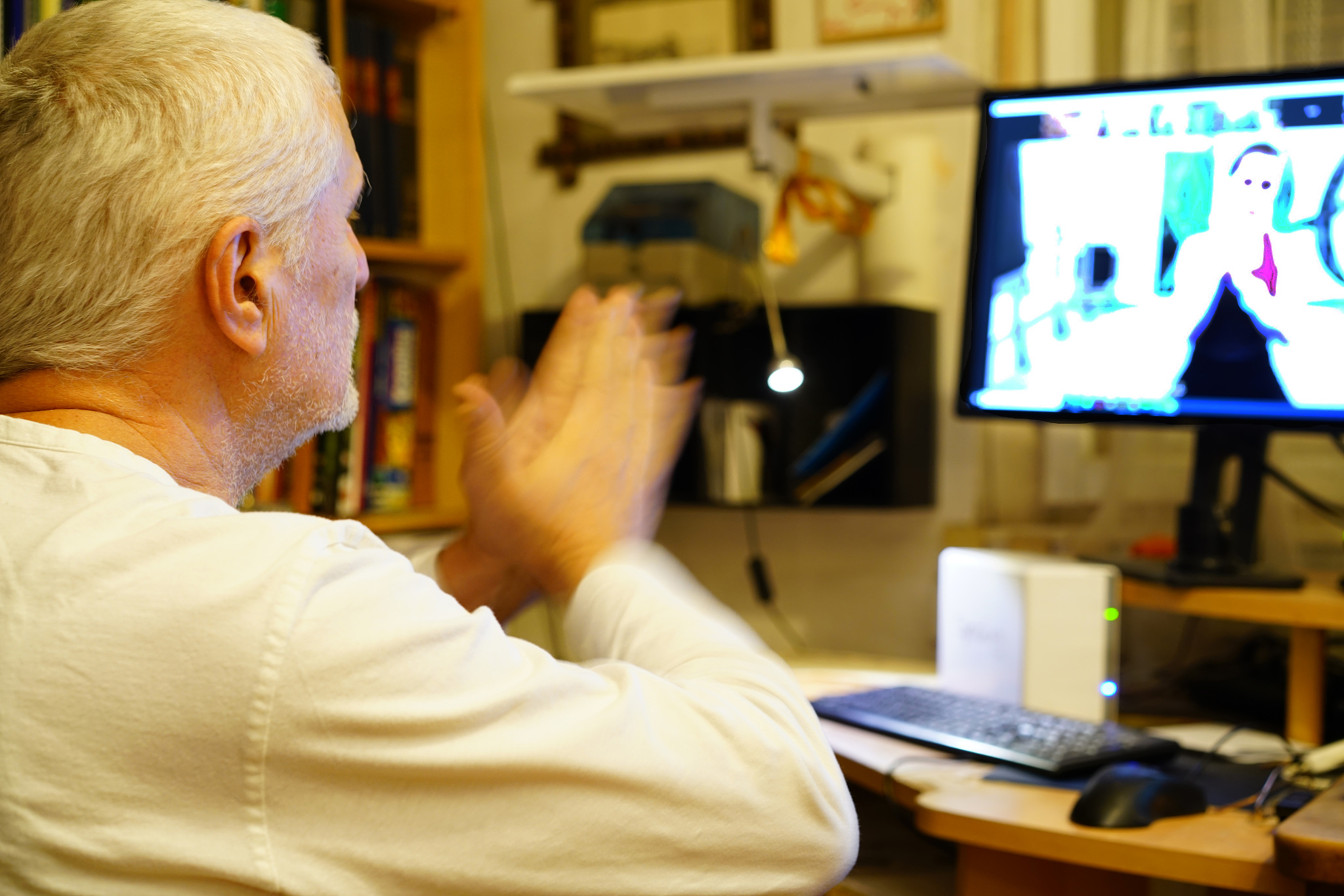 senior man online exercising dancing with help of a physical the