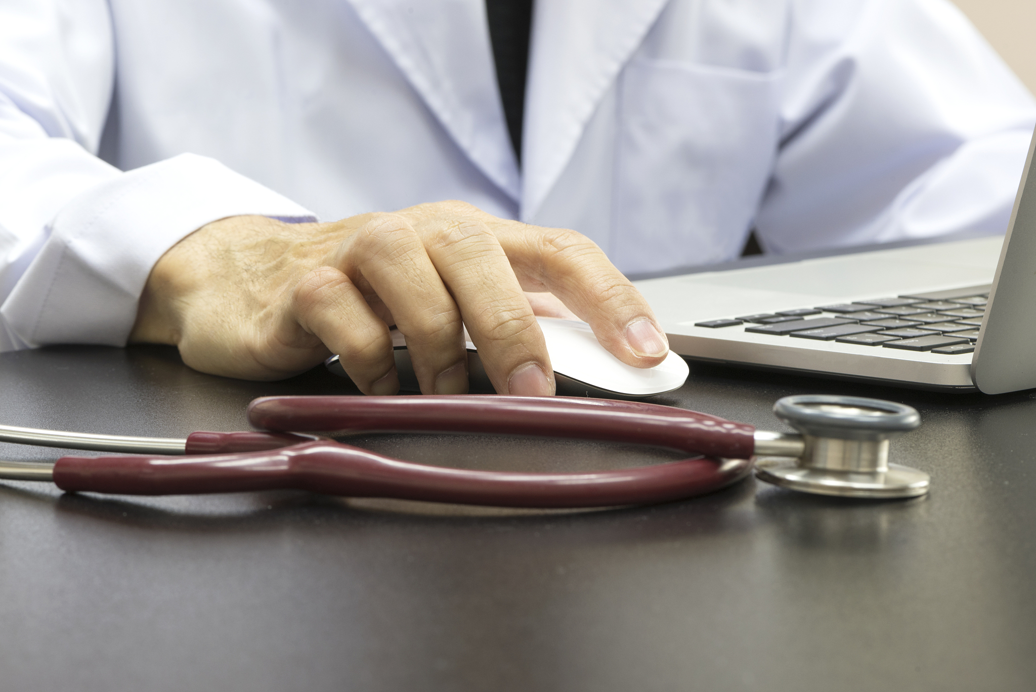 doctor using notebook computer