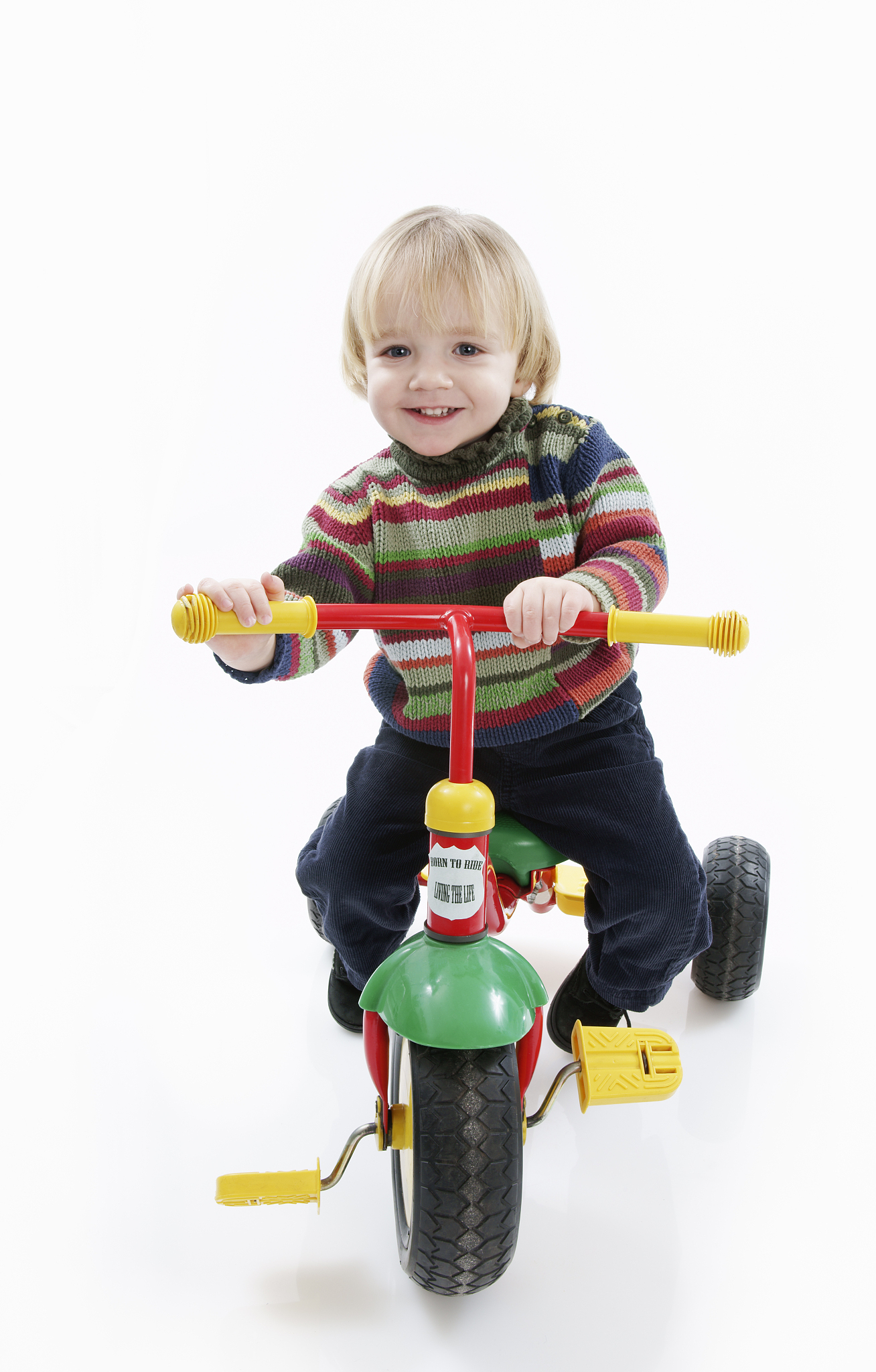 happy preschooler on a tricycle