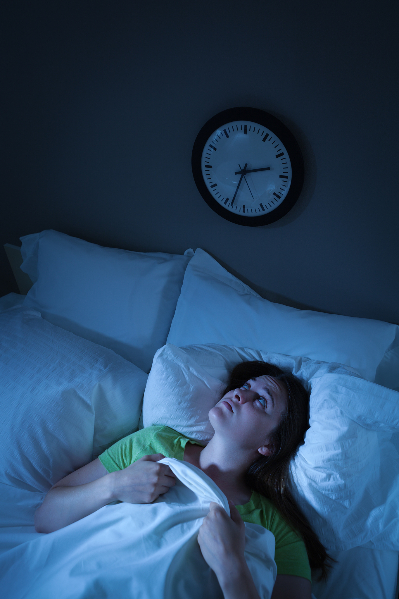 sleepless insomnia woman waking in stress and anxiety in bed