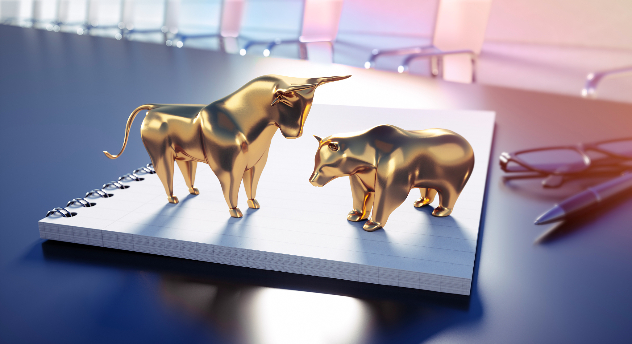 golden bull and bear on notebook