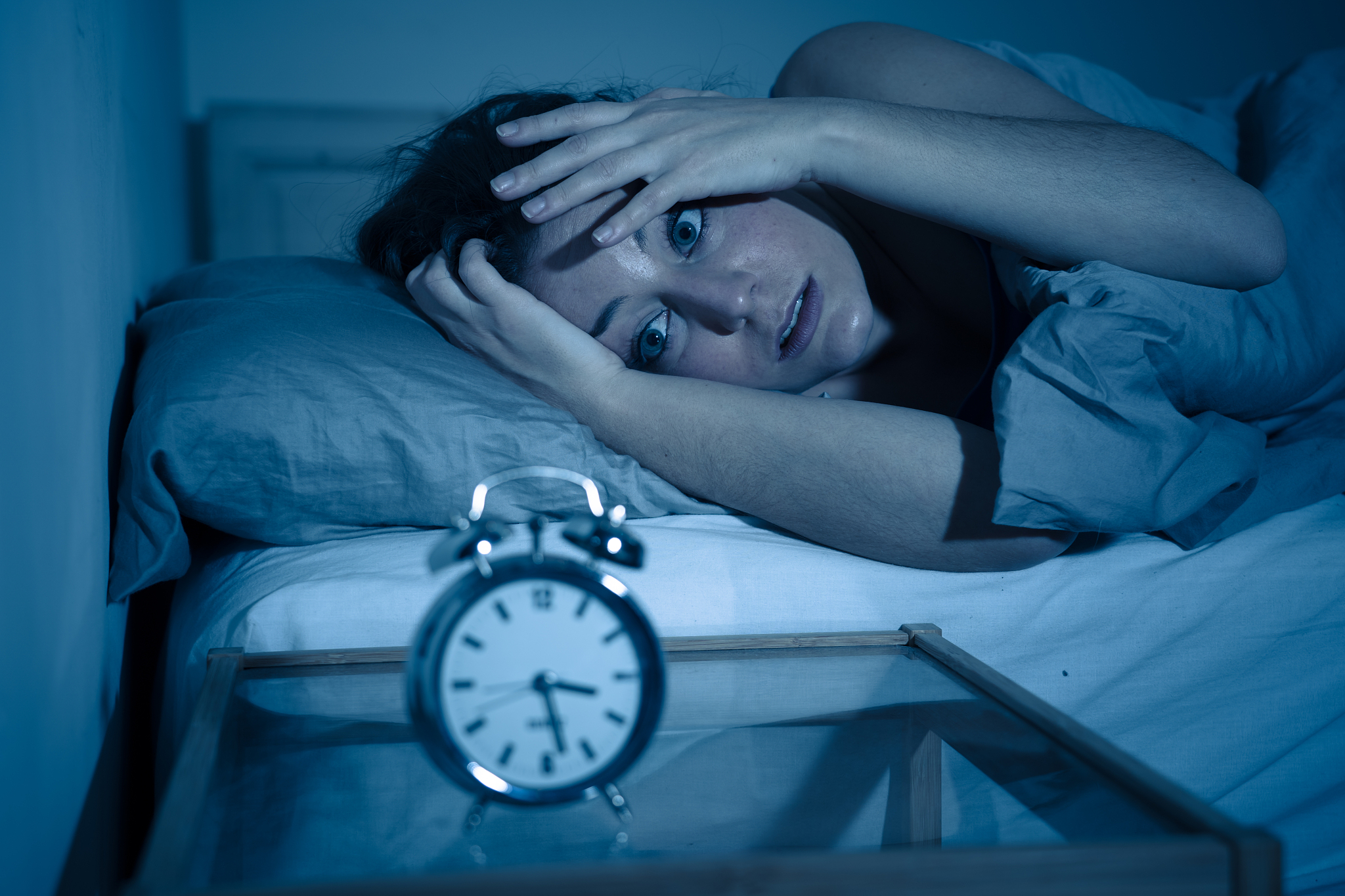 sleepless and desperate beautiful caucasian woman awake at night