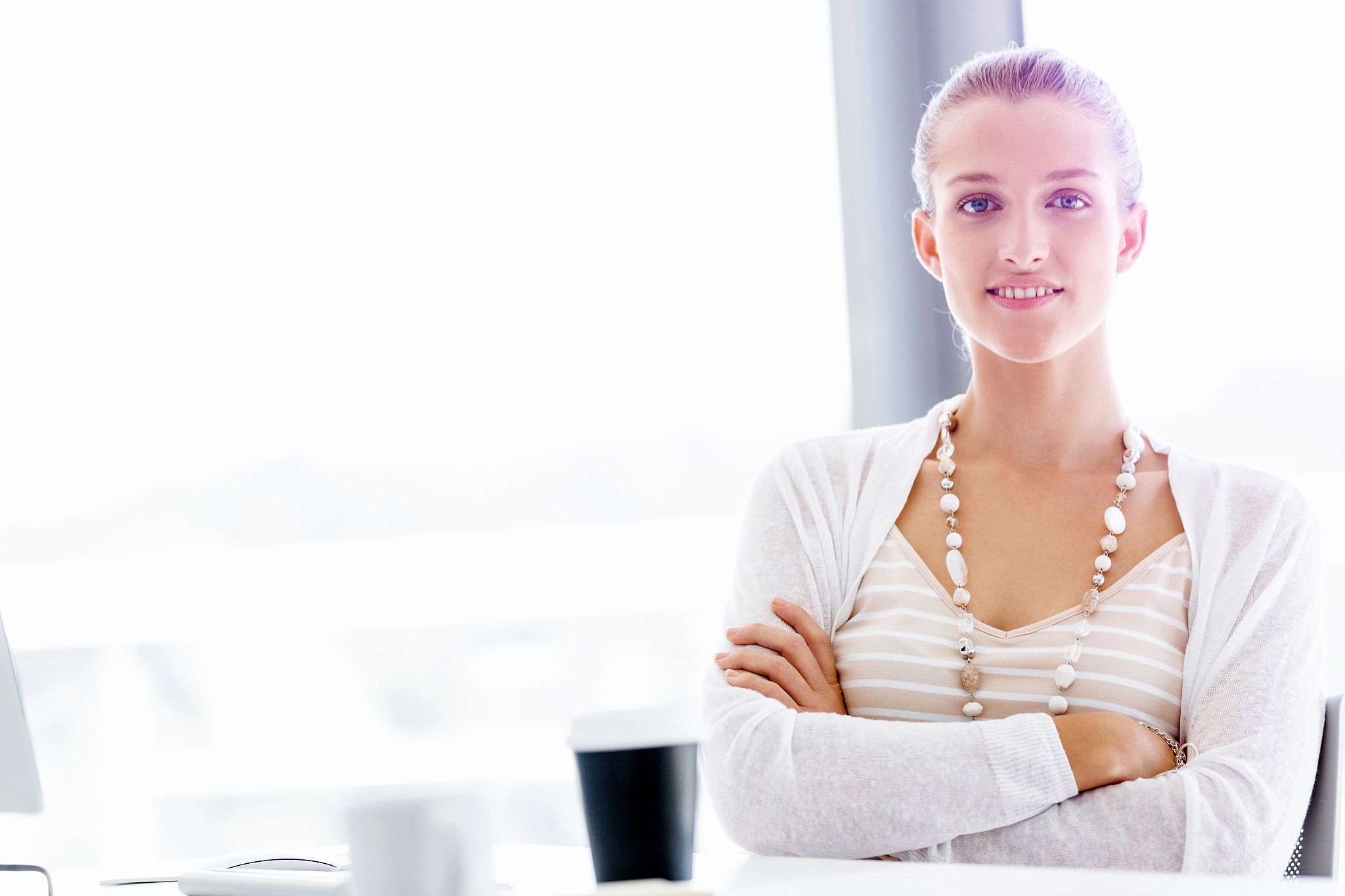 attractive office worker sitting at desk. attractive woman sitti