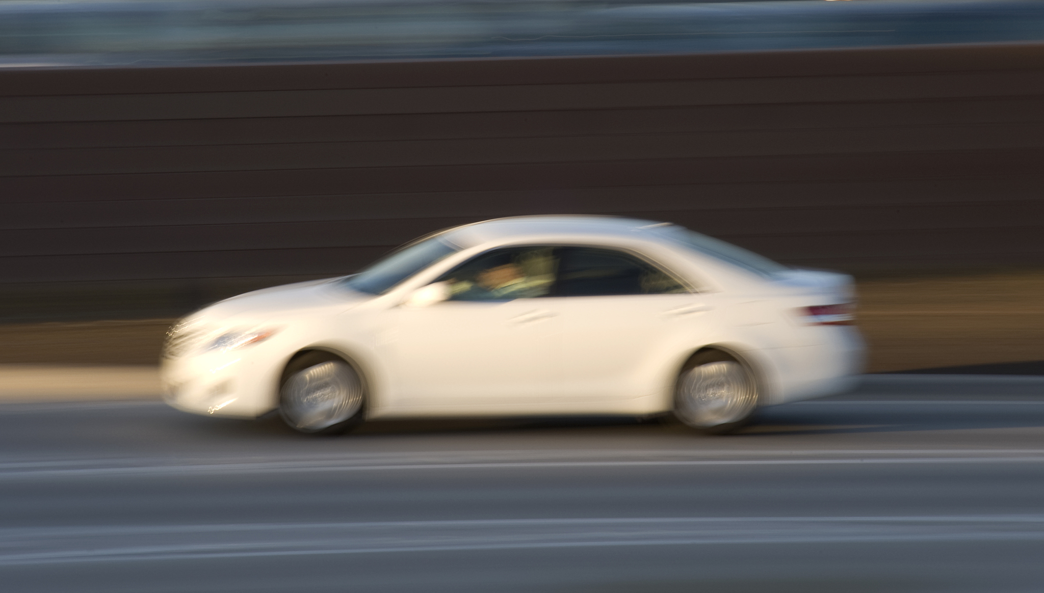 mid-size car on the highway, blurred motion
